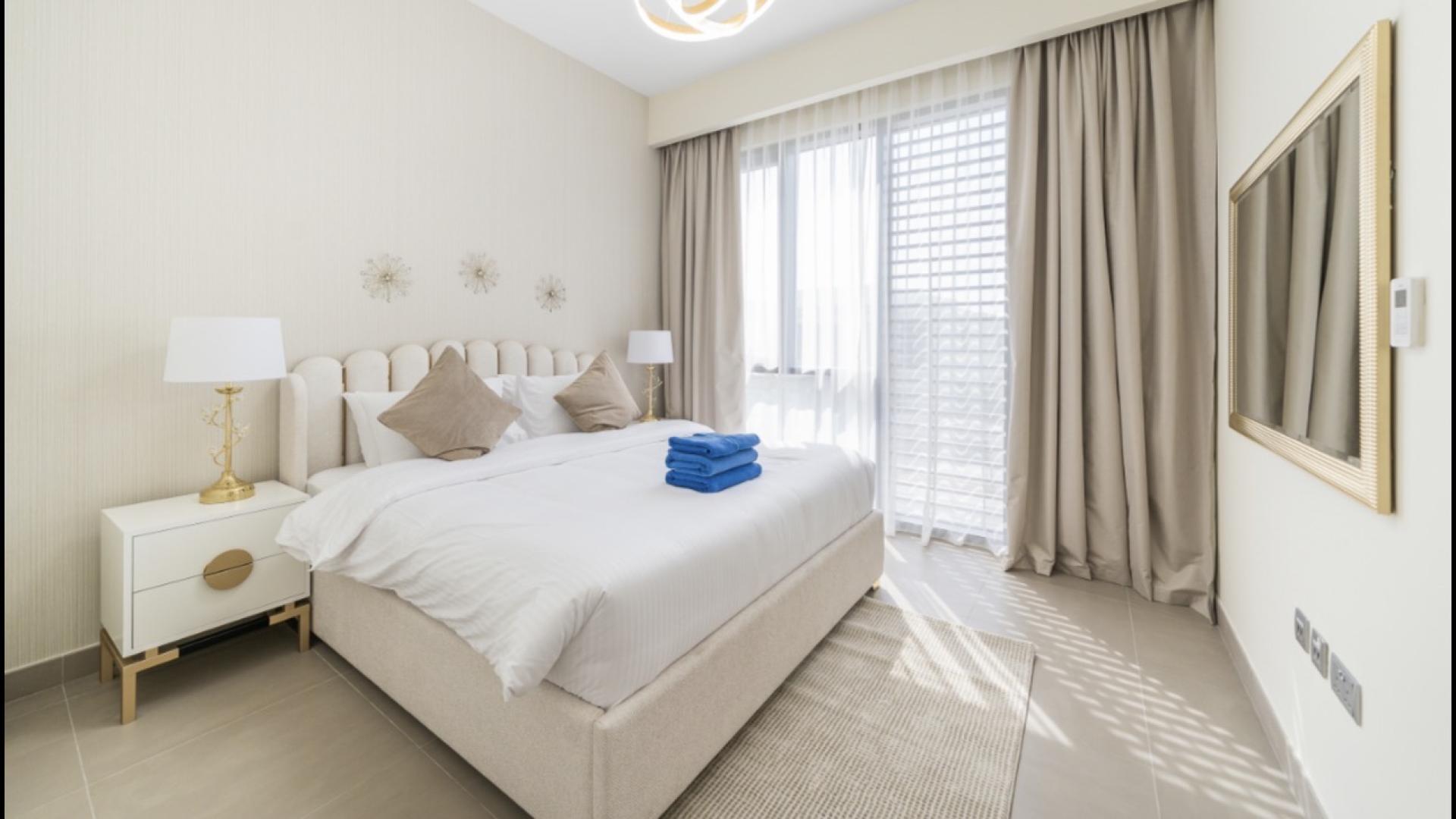 Modern living room in Sidra villa, Dubai Hills Estate with elegant decor and open kitchen