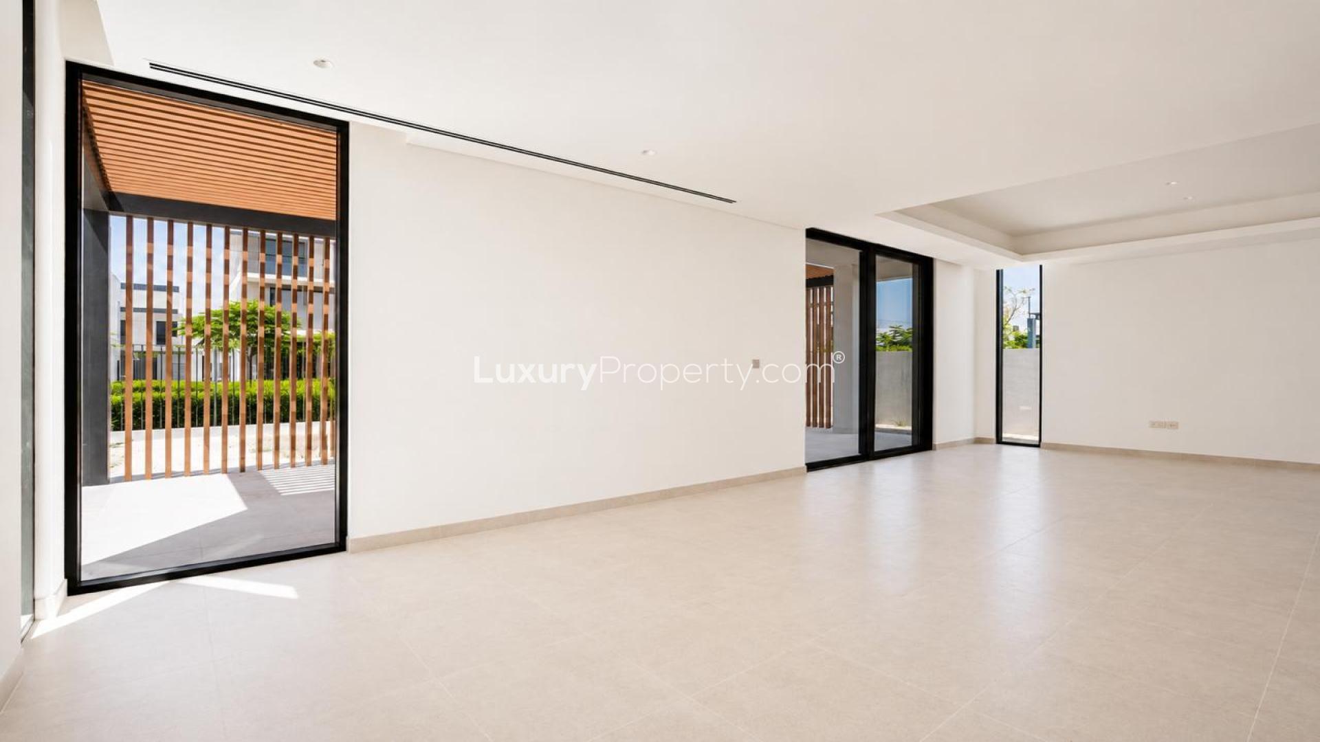 Spacious living room in Elie Saab 1 villa, Arabian Ranches 3, with large windows