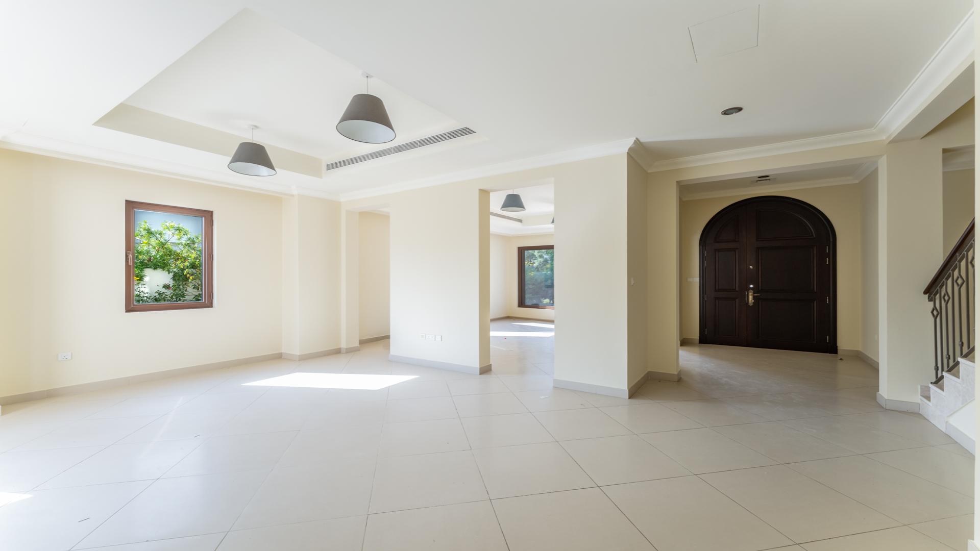 Open plan living area in Yasmin Villa, Arabian Ranches 2, with modern kitchen