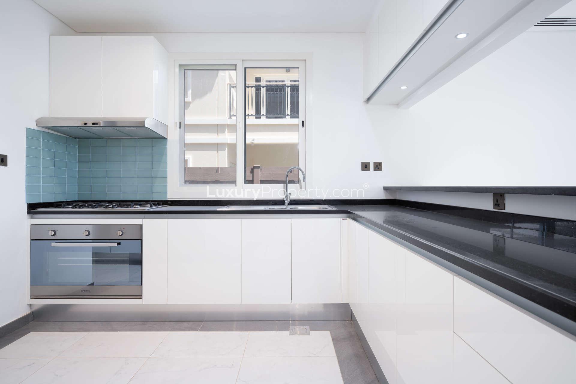 Modern kitchen and living area in 4-bedroom Al Habtoor Polo Club villa, Dubai