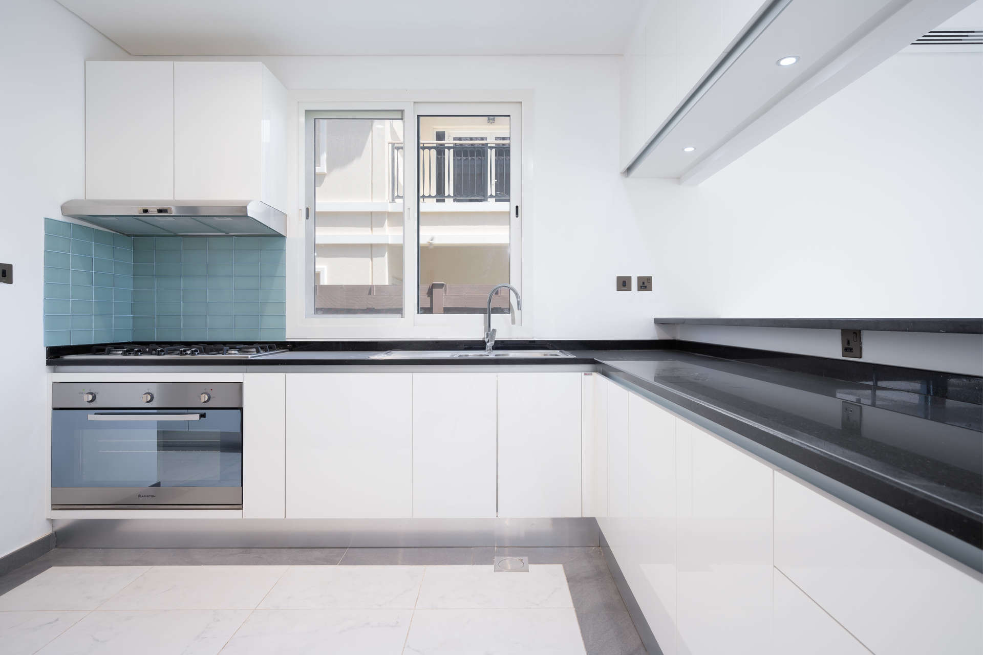 Modern kitchen and living area in 4-bedroom Al Habtoor Polo Club villa, Dubai