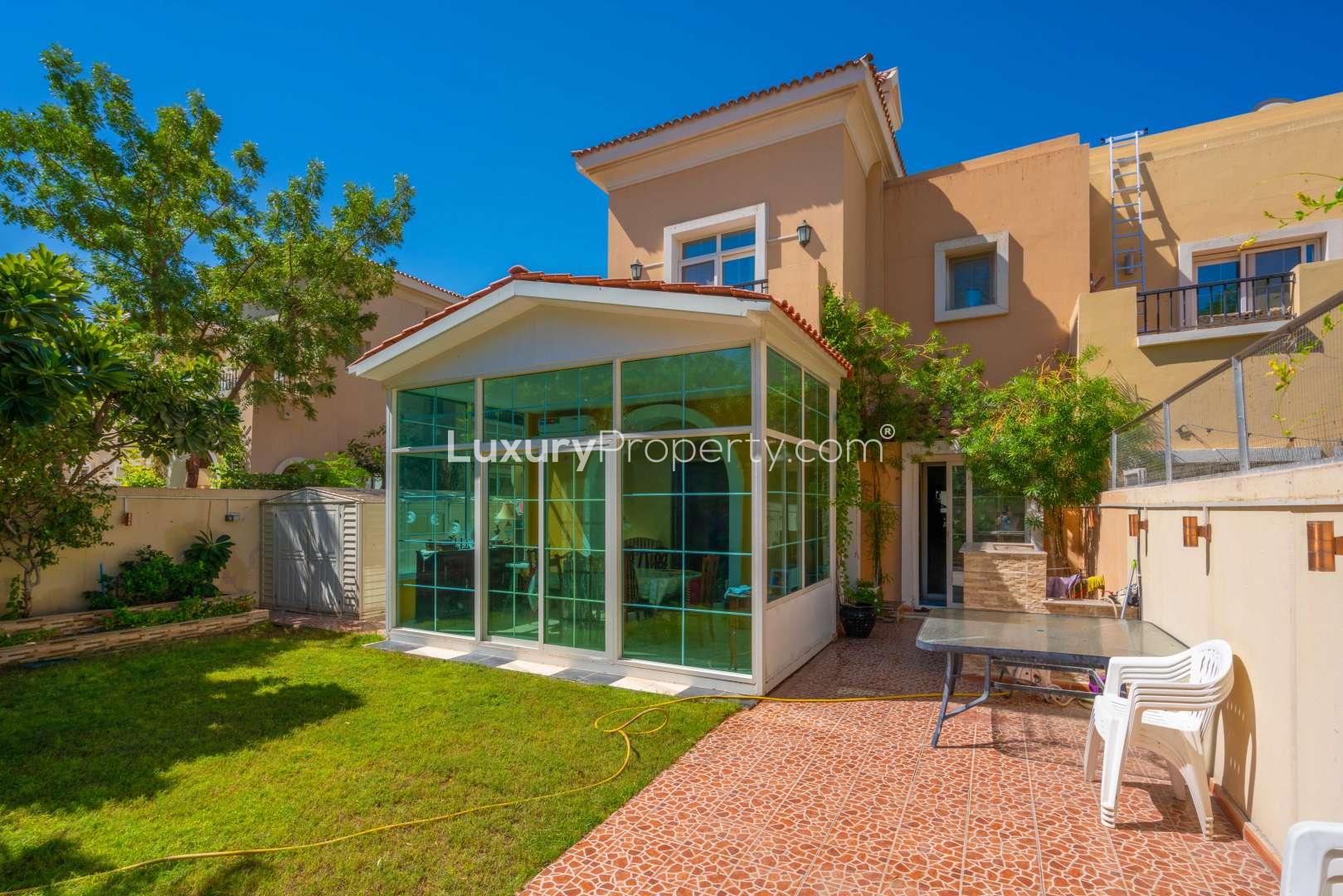 Modern kitchen in upgraded 4-bedroom villa, Arabian Ranches Al Reem, with island seating