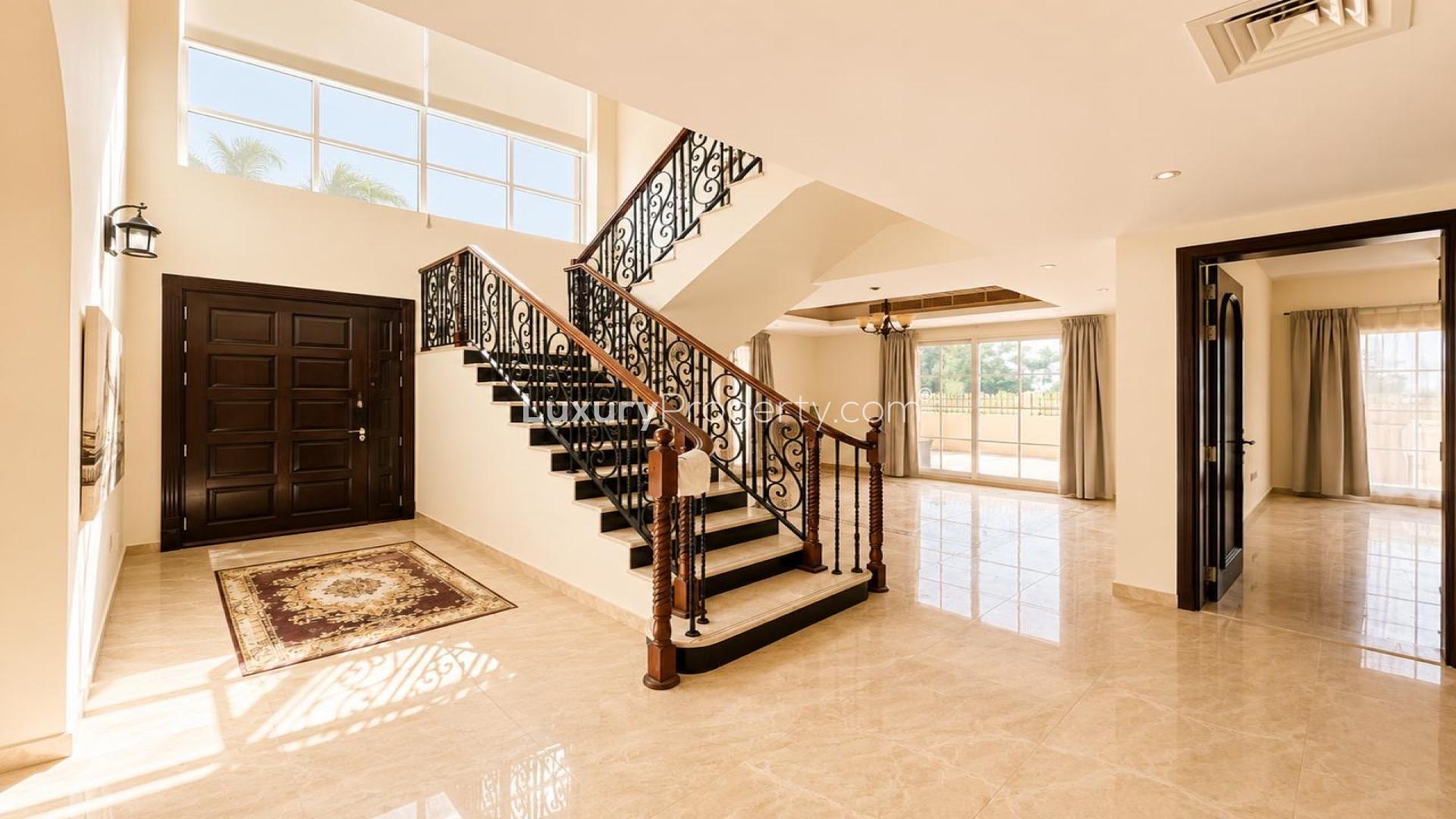 Spacious living area in The Aldea villa with elegant flooring and large windows