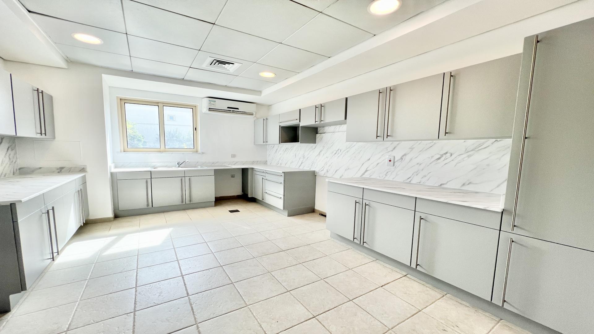 Bright, spacious interior of Jumeirah Islands villa with large windows and elegant finishes