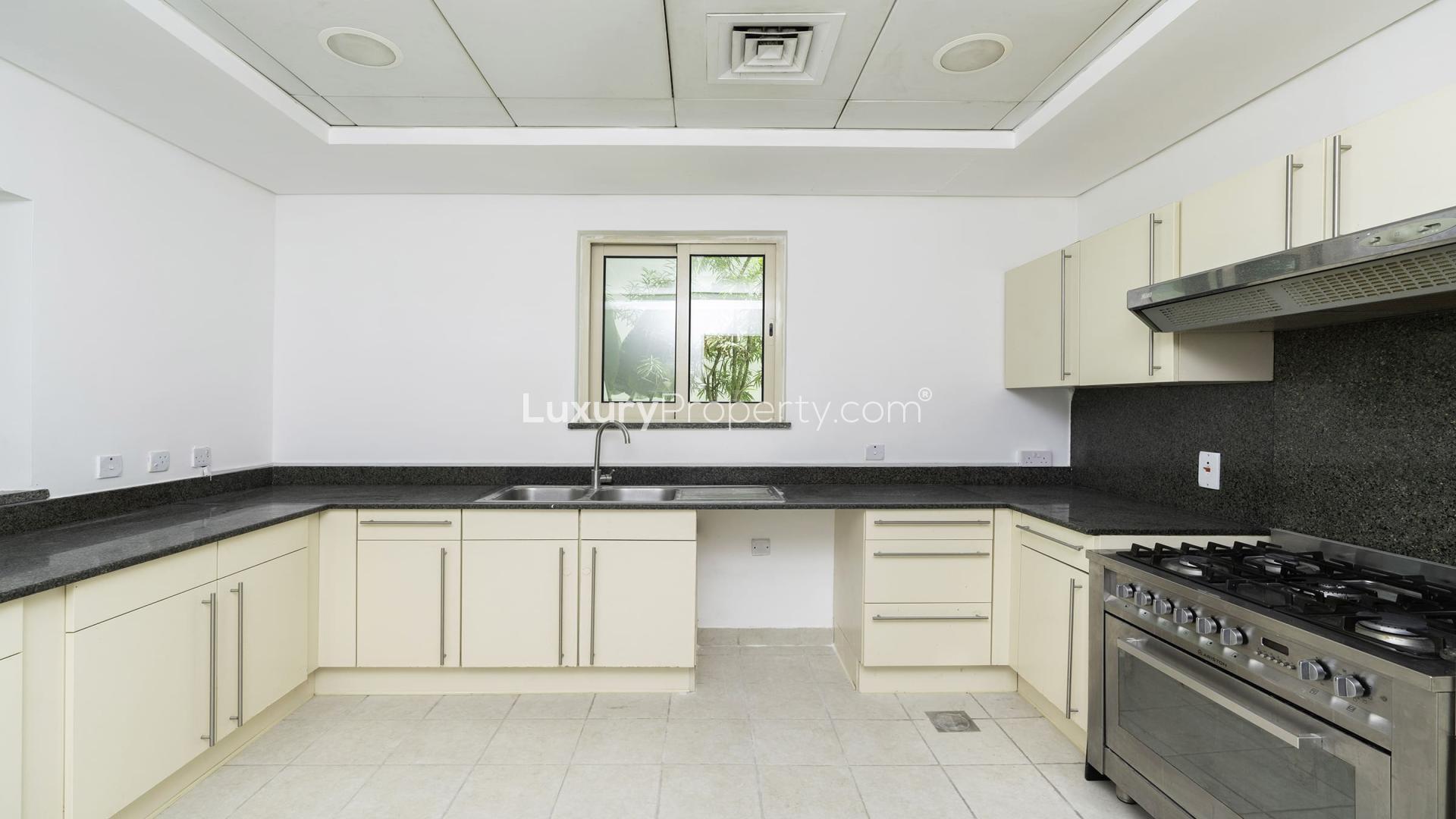 Unfurnished villa kitchen with modern appliances, granite countertops, Jumeirah Islands Mediterranean Clusters