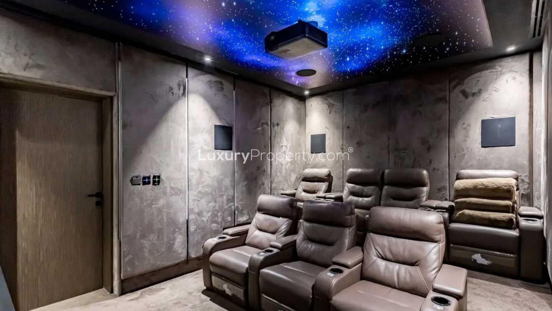 Luxury furnished living room in Jumeirah Islands villa, featuring modern decor and chess set