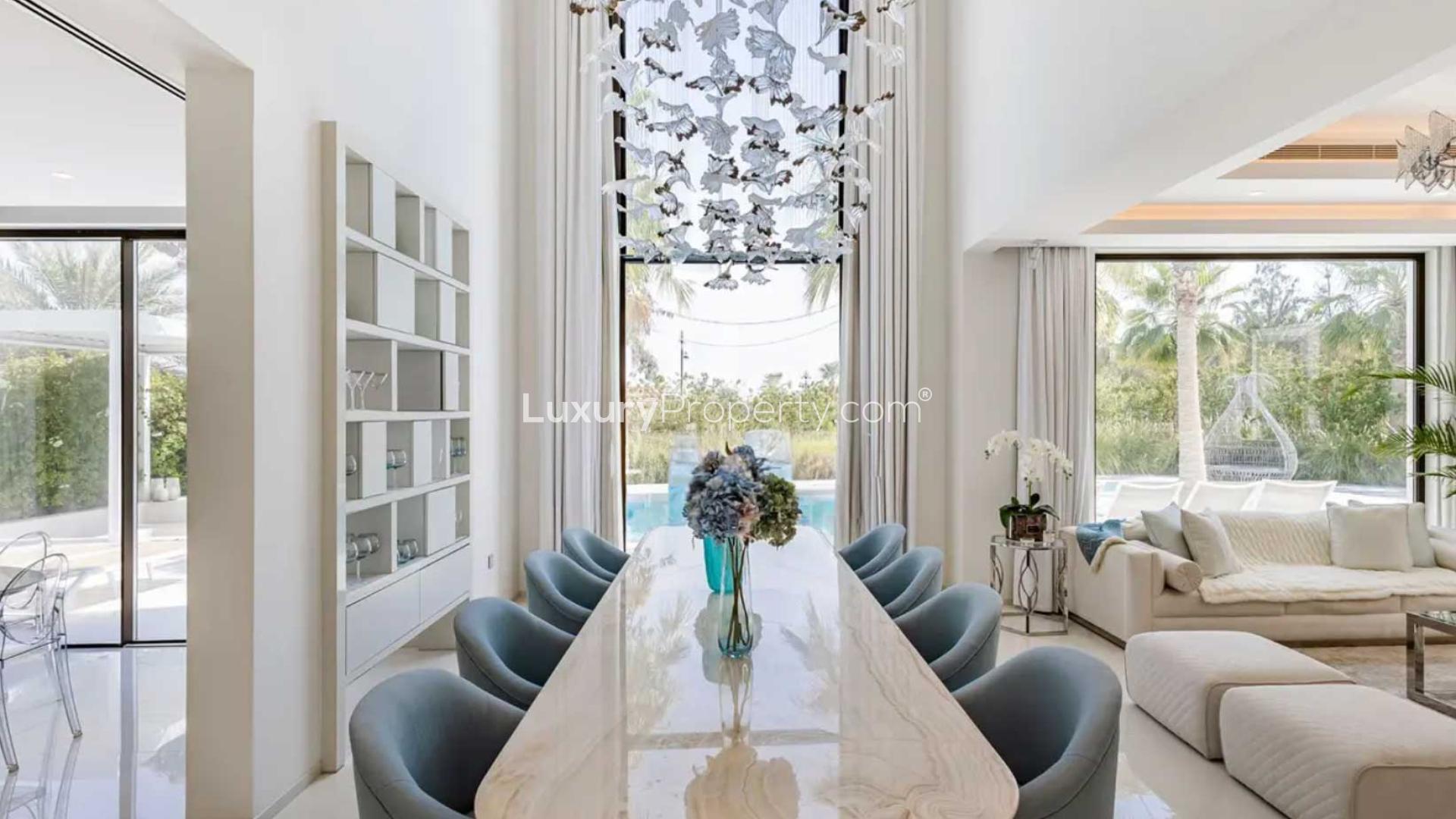 Luxury villa pool with palm trees in Jumeirah Islands' Mediterranean Clusters