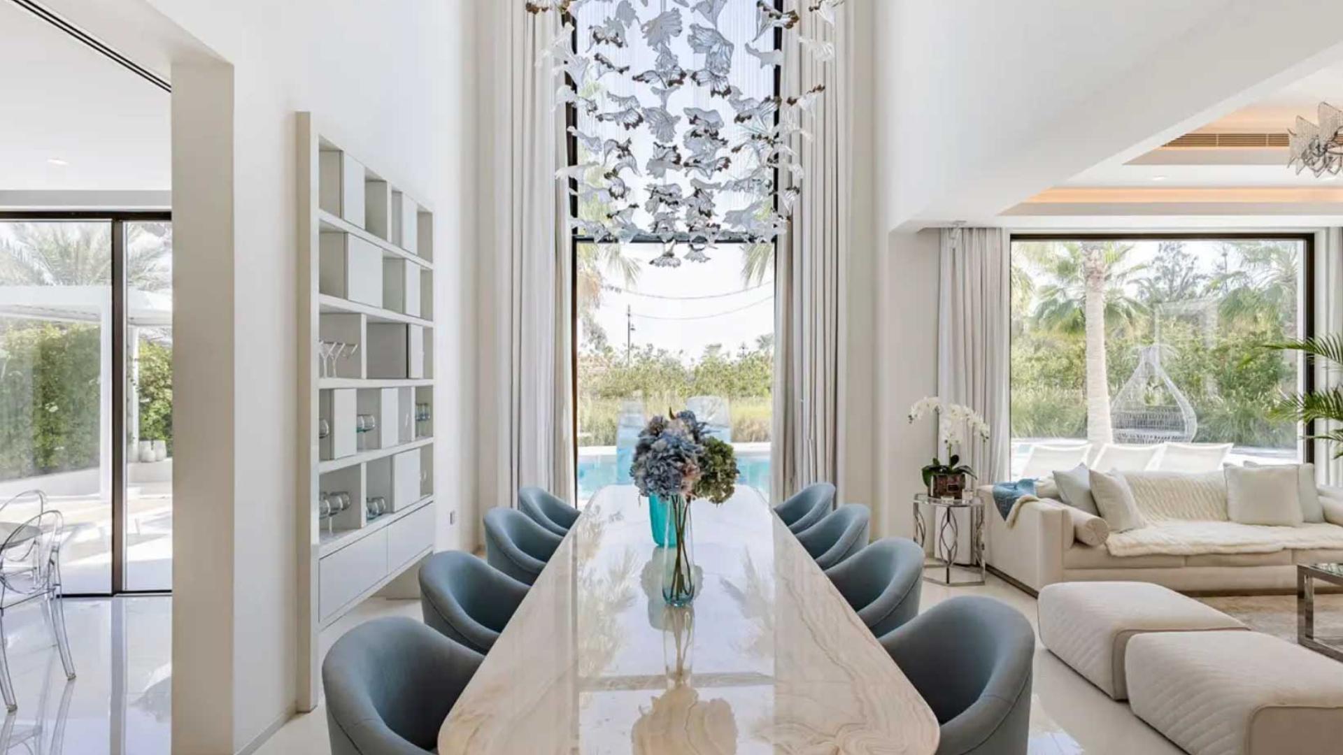 Luxury villa pool with palm trees in Jumeirah Islands' Mediterranean Clusters