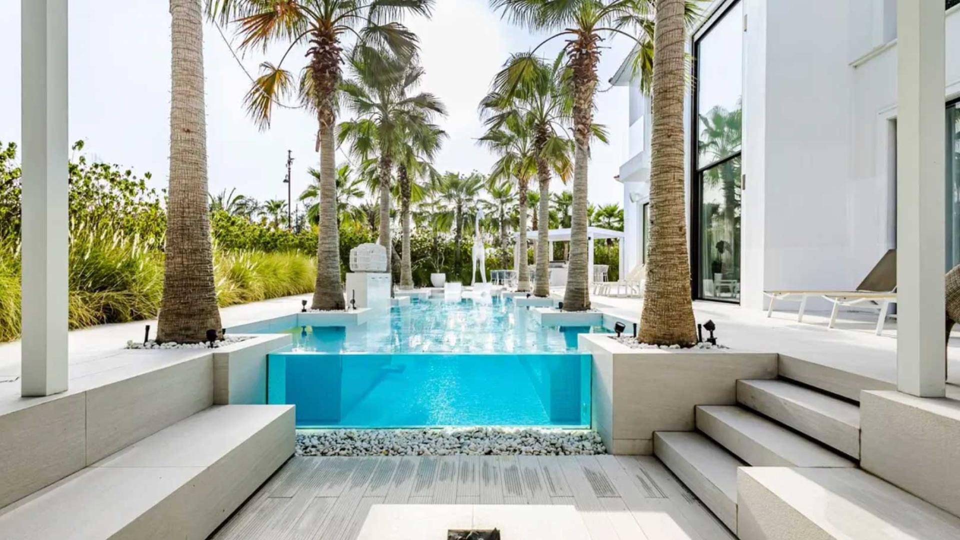 Luxury villa interior with modern staircase and spacious living area in Jumeirah Islands