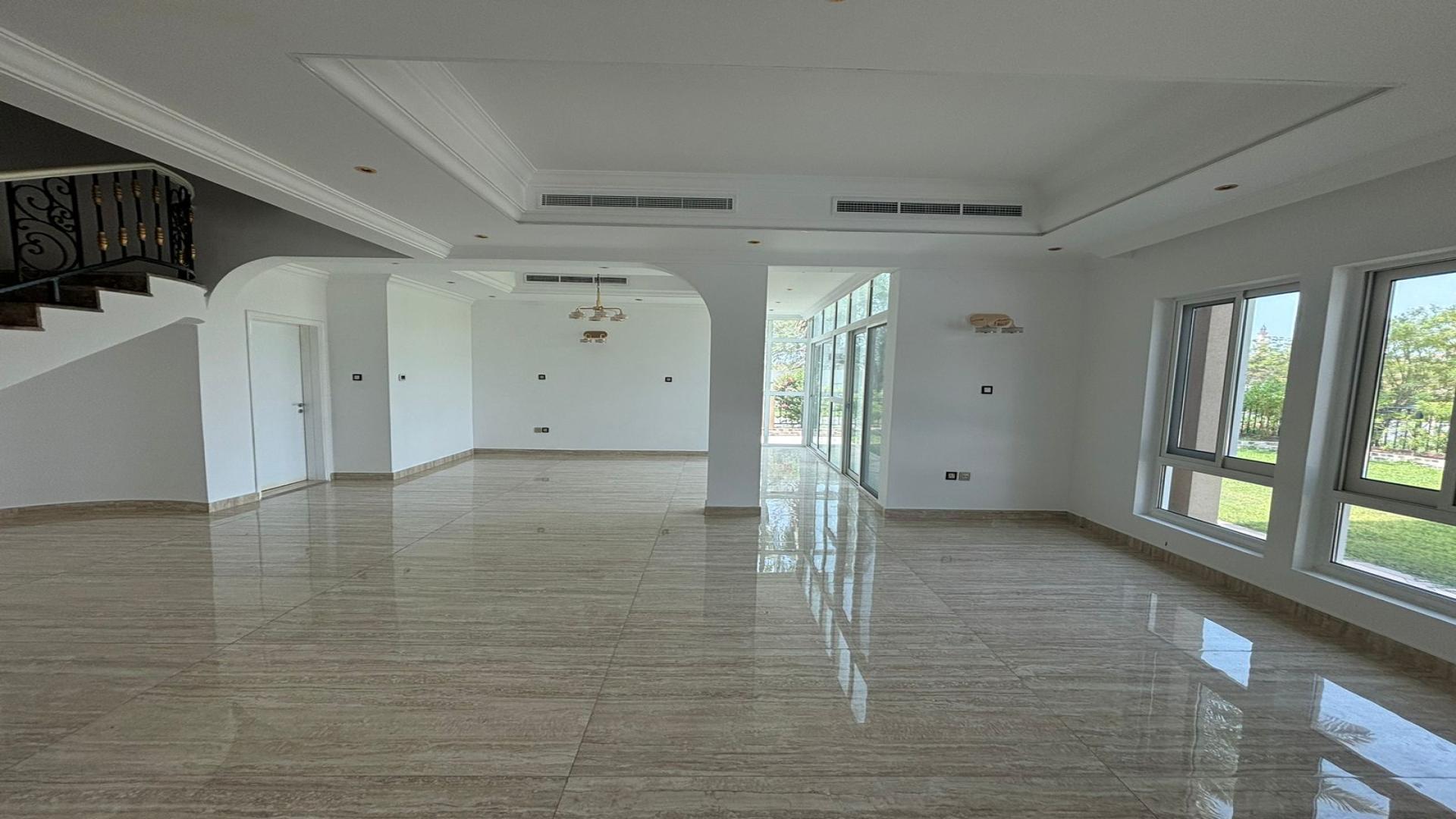 Poolside view of four-bedroom villa in Jumeirah Islands, Mediterranean Clusters, available for rent