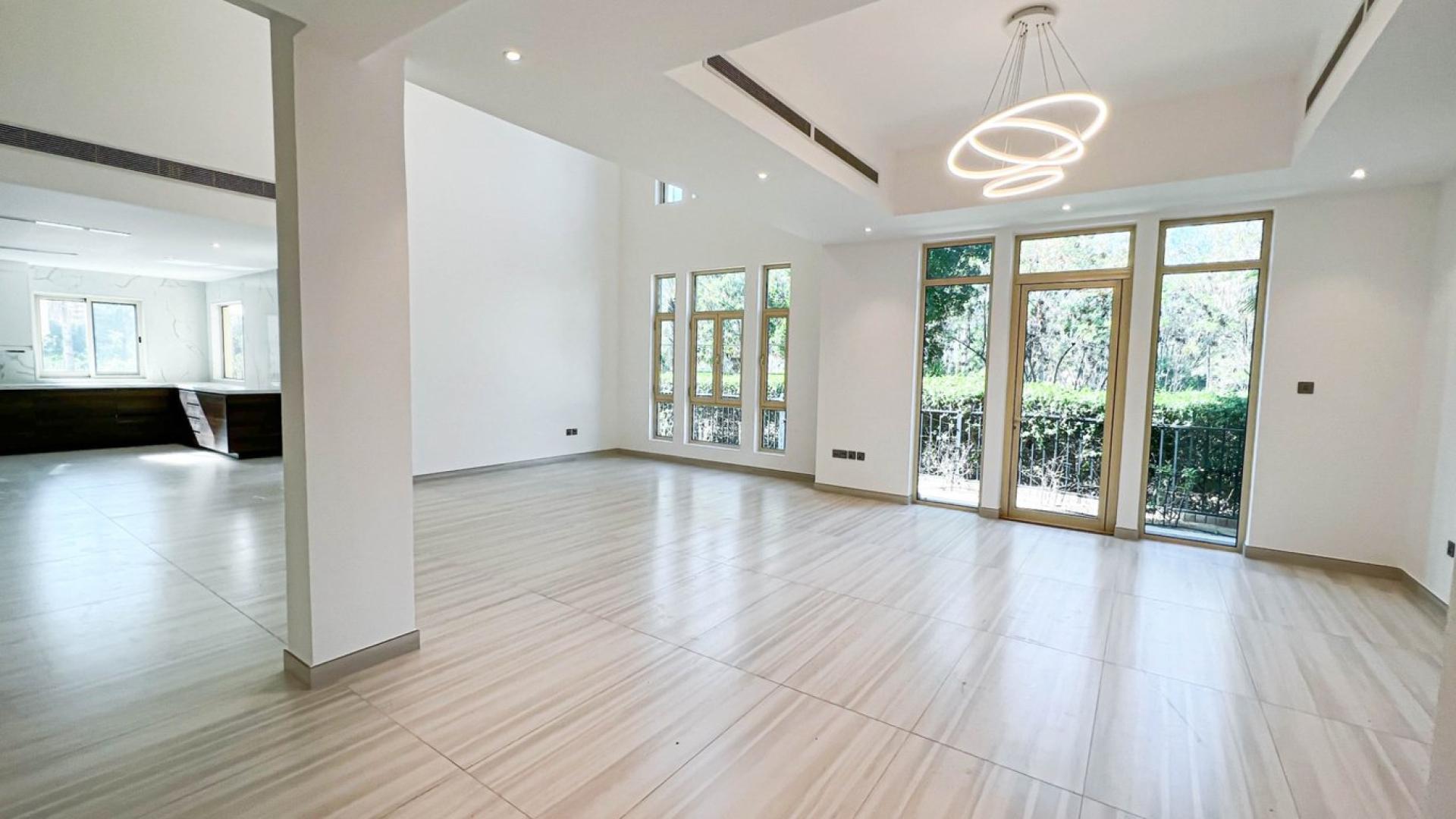 Spacious living area in upgraded Jumeirah Islands villa with modern finishes and staircase