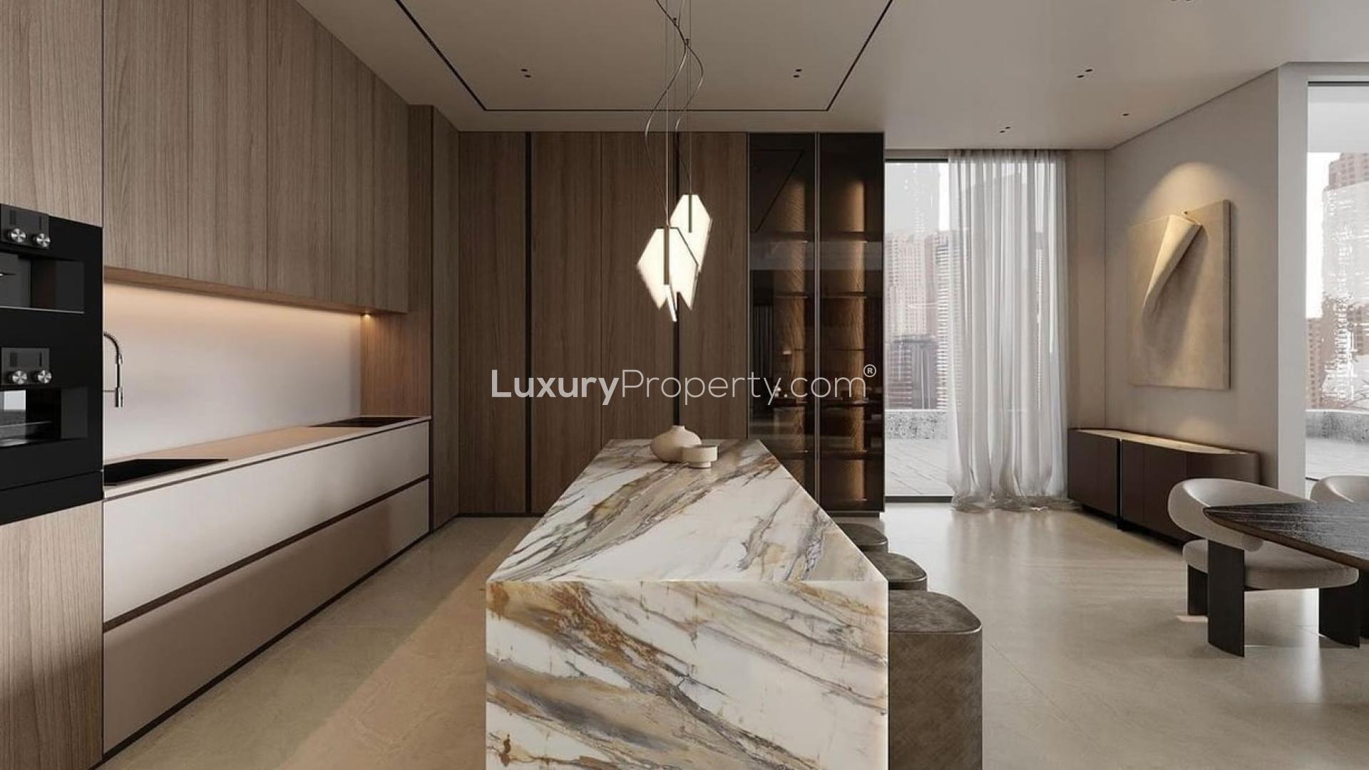 "Modern kitchen in furnished 4-bedroom Vastu villa, Jumeirah Islands, Mediterranean Clusters.",Luxurious kitchen with marble island in Jumeirah Islands Mediterranean villa for rent