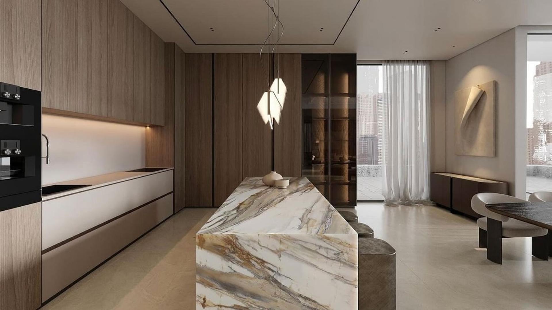 "Modern kitchen in furnished 4-bedroom Vastu villa, Jumeirah Islands, Mediterranean Clusters.",Luxurious kitchen with marble island in Jumeirah Islands Mediterranean villa for rent