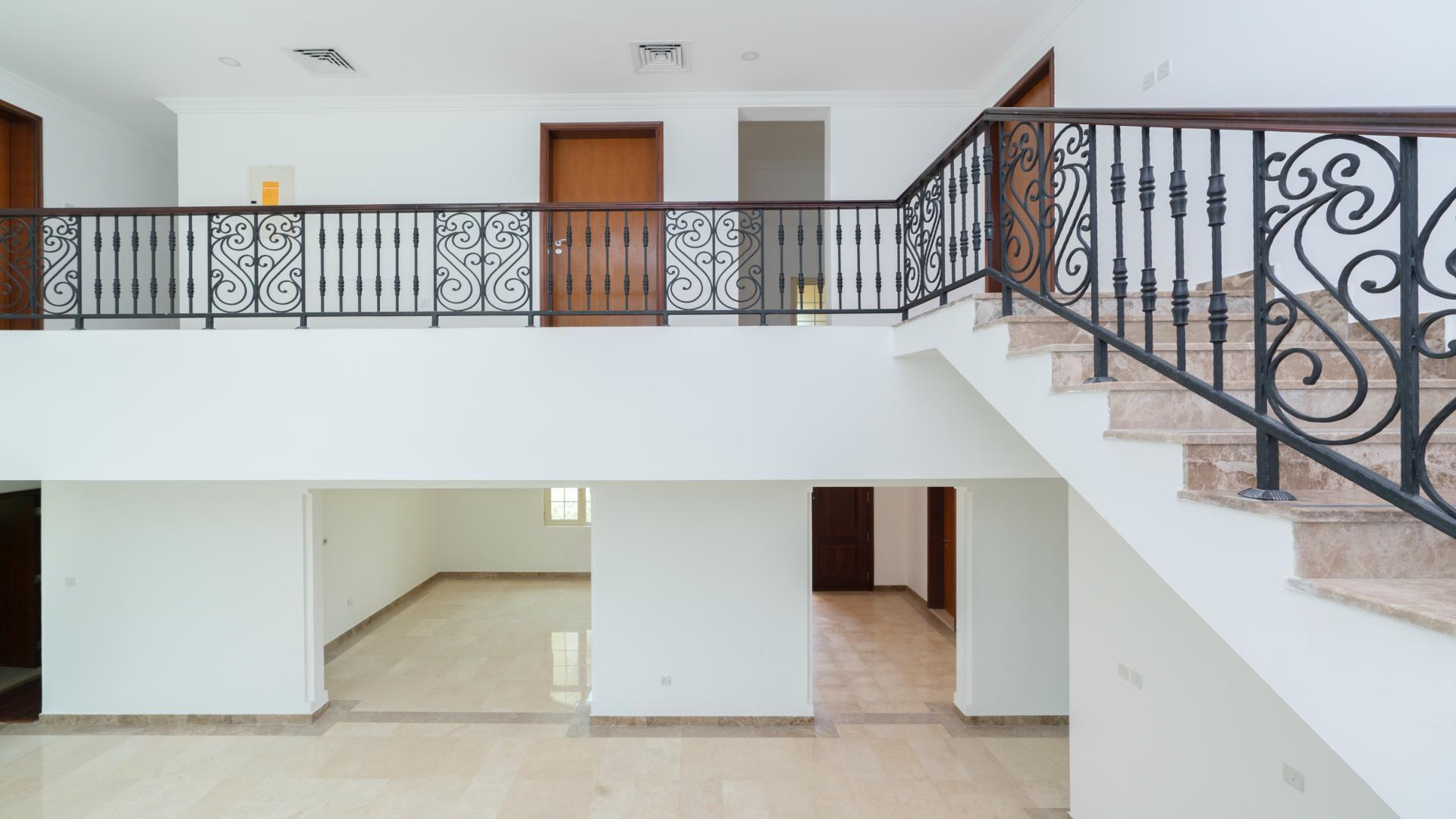 Interior of luxury villa with elegant staircase and large windows in Jumeirah Islands