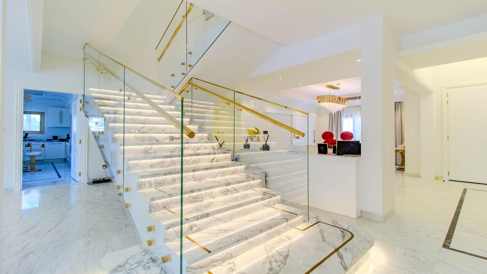 Luxurious living room in spacious Jumeirah Islands villa with elegant decor and large windows