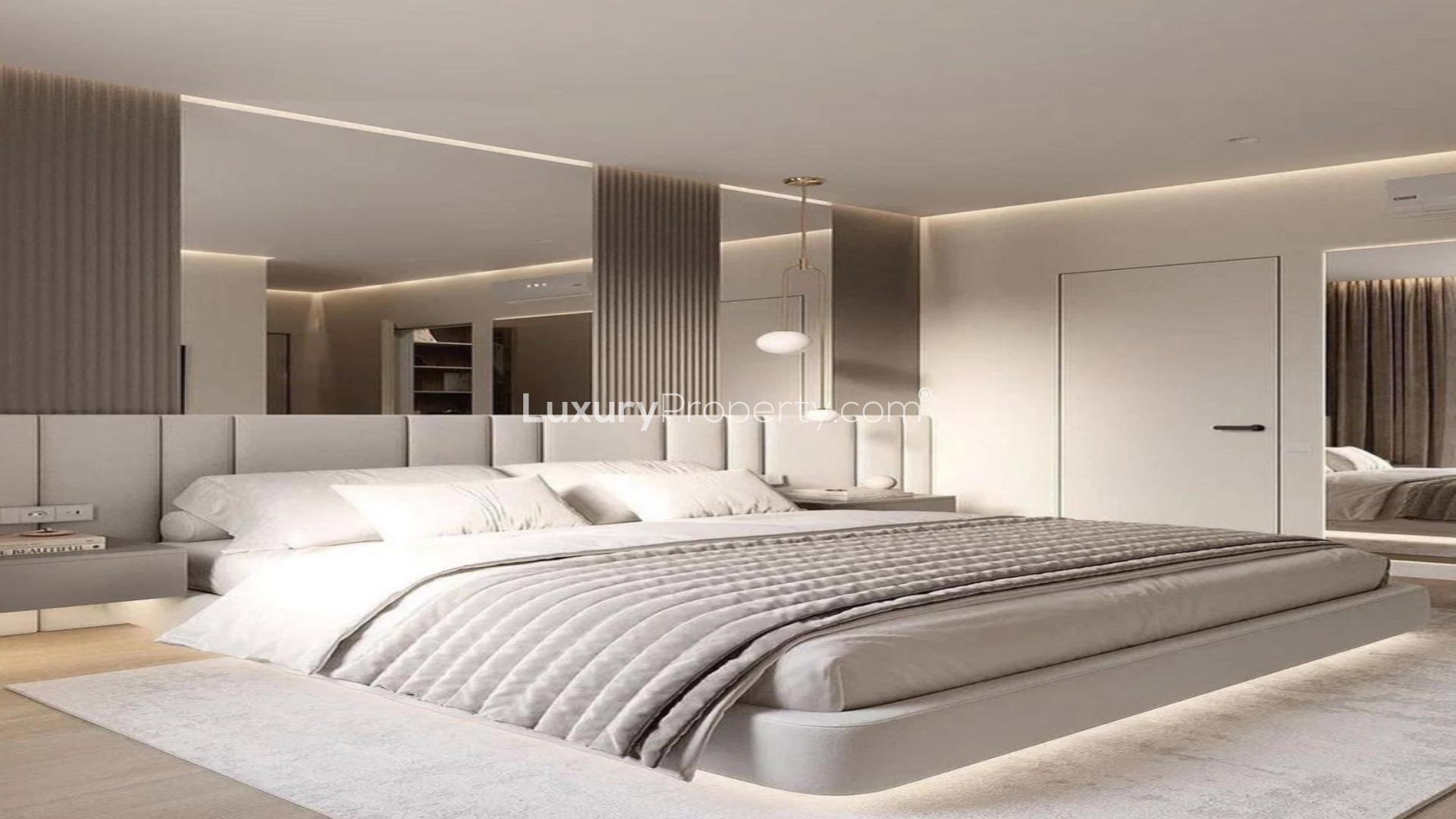 Contemporary villa bedroom with elegant chandelier in Jumeirah Islands, Mediterranean Clusters