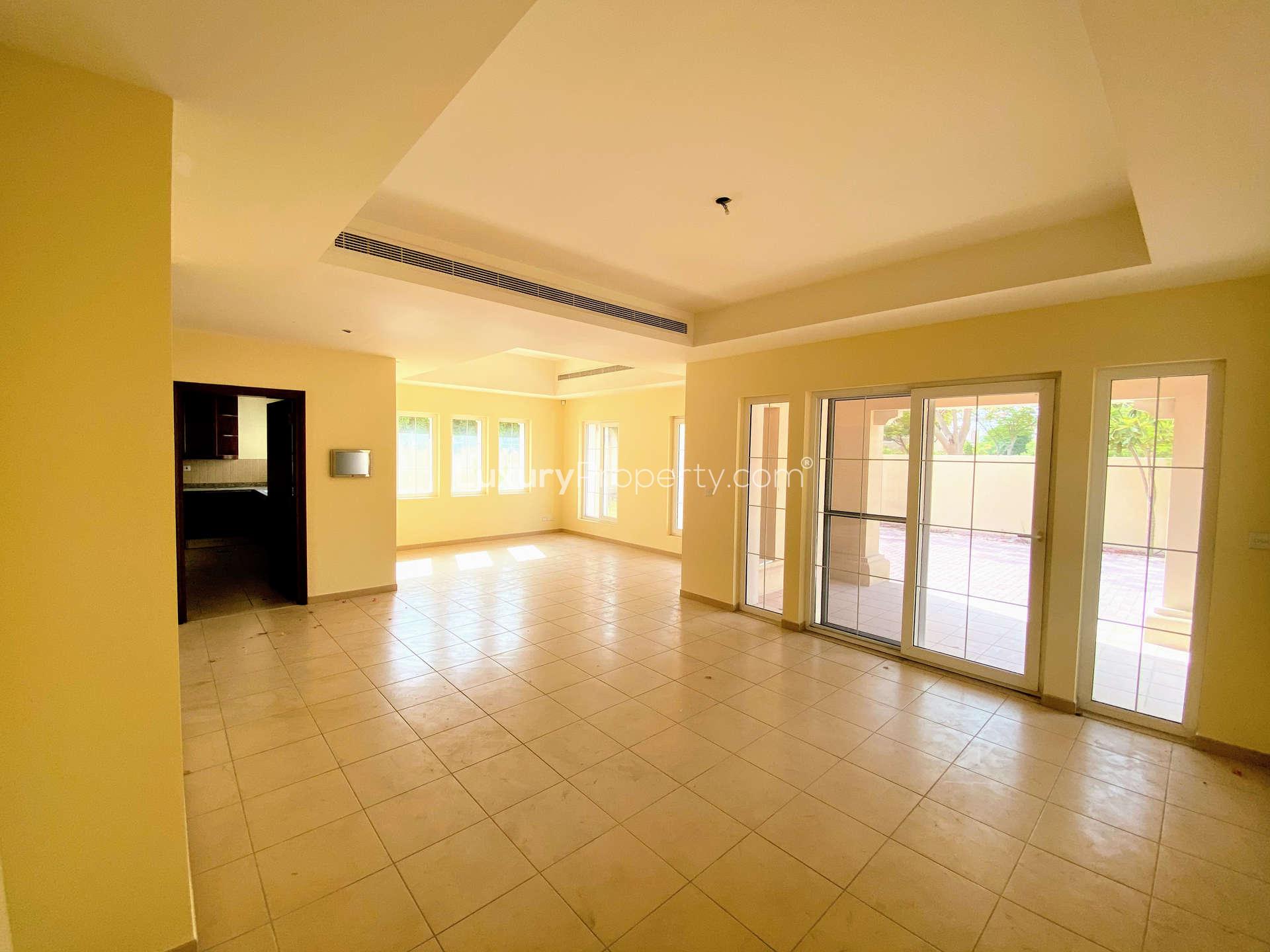 Spacious living area with tiled floors and balcony in Alvorada 2 villa, Arabian Ranches