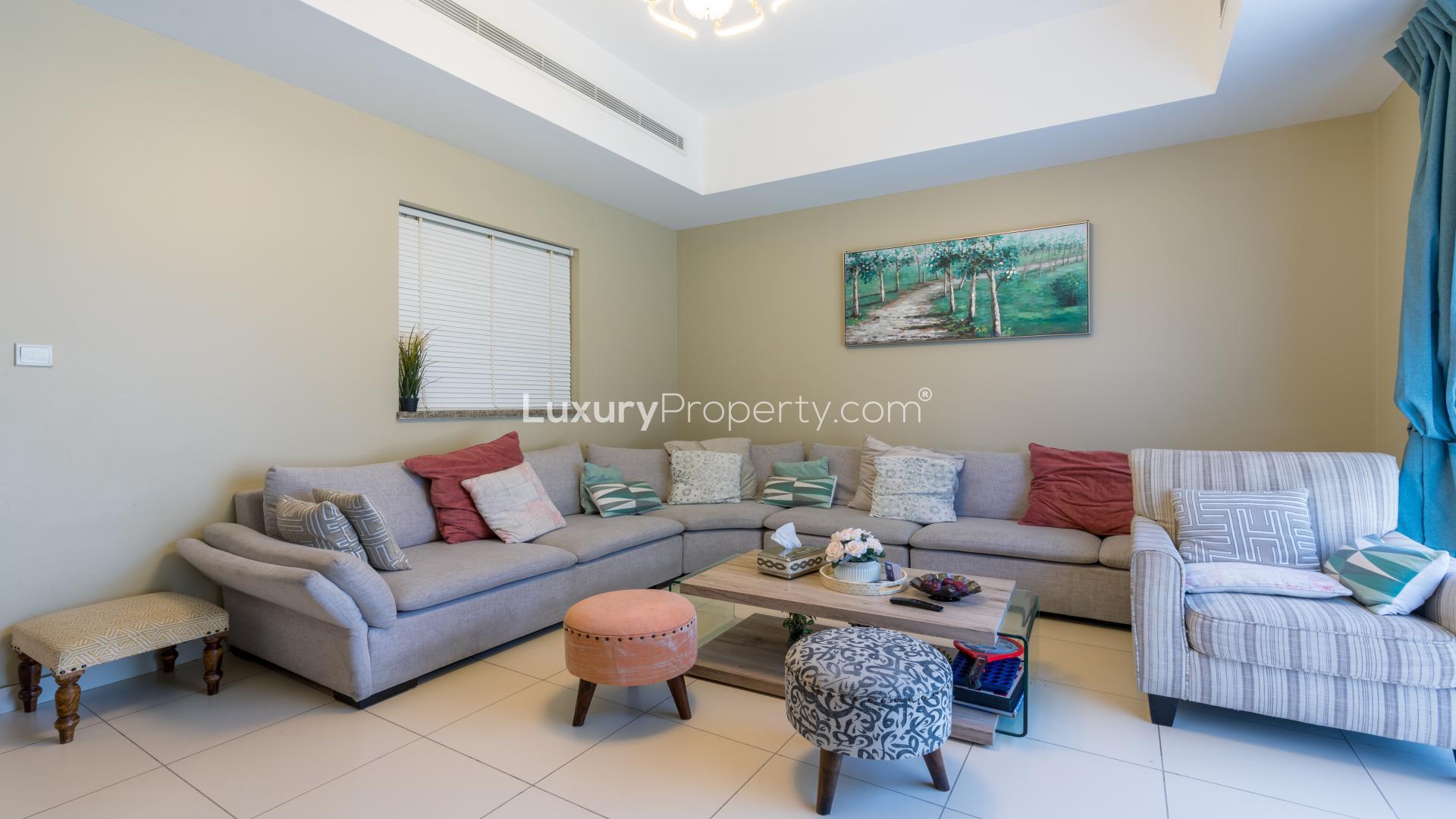 Chic living room in 4-bedroom villa, Mira Community, Reem, with cozy seating and decor