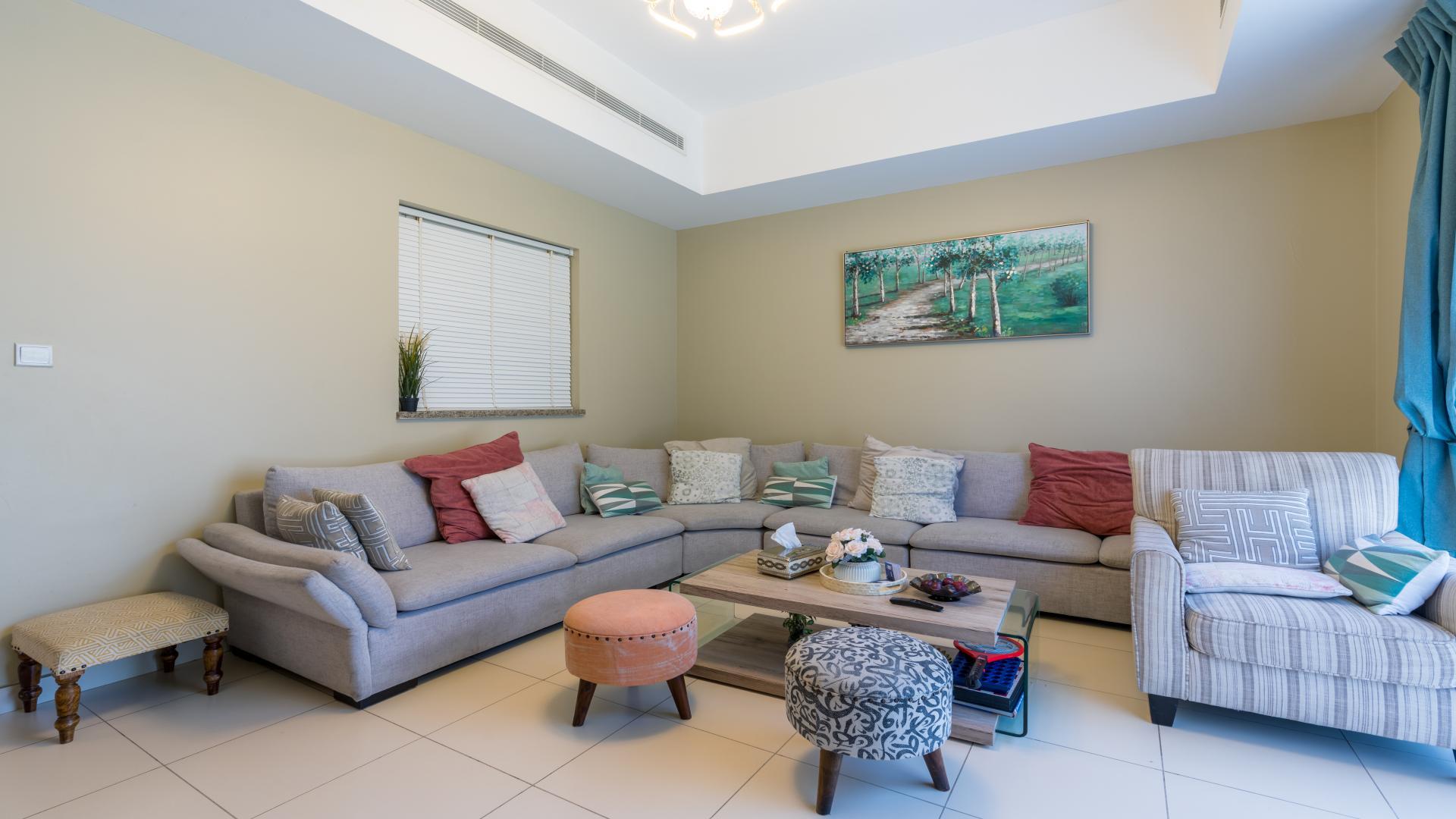 Chic living room in 4-bedroom villa, Mira Community, Reem, with cozy seating and decor