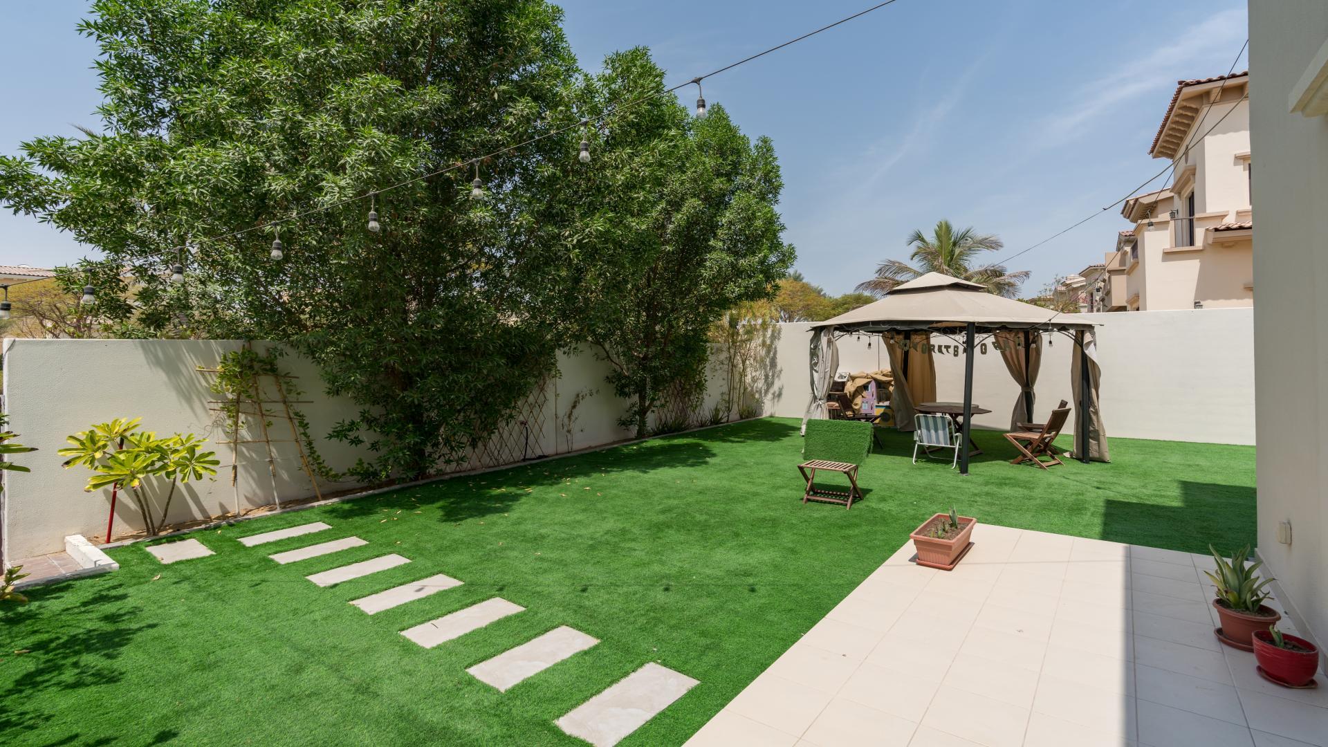 Chic villa garden with lush greenery and gazebo in Reem's Mira Community for rent