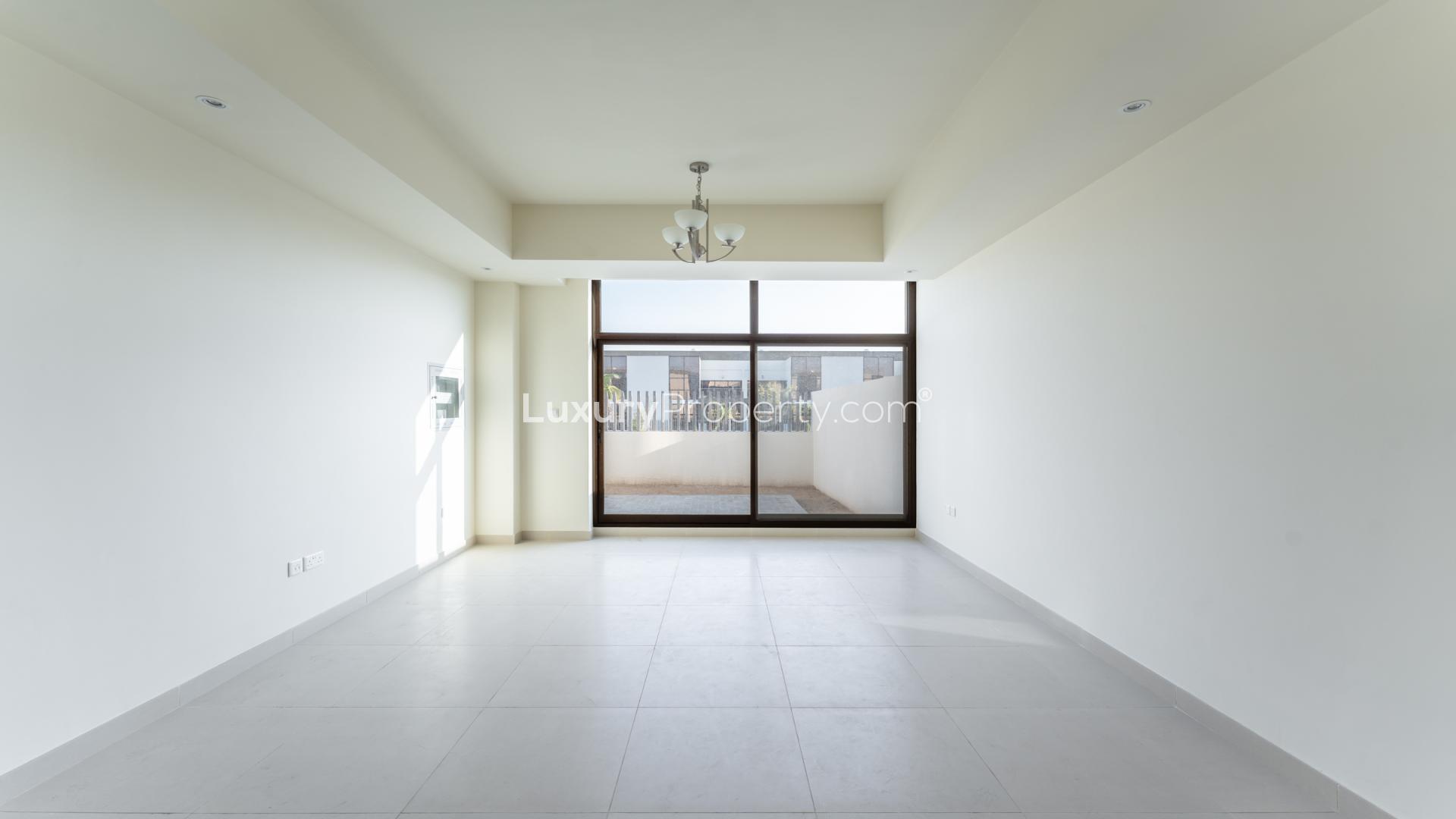 "Bright villa interior with high ceilings and large windows in Mohammed Bin Rashid City.","Bright villa bedroom with large window and built-in wardrobe in District 11, MBR City.",Modern bathroom in Middle-Row Villa, District 11, Mohammed Bin Rashid City, available for rent