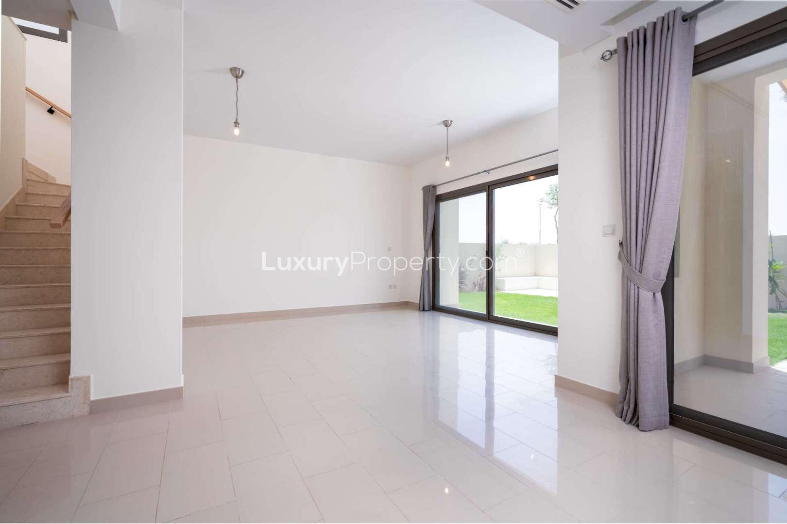 Spacious living room with large windows in 4-bedroom villa, Azalea, Arabian Ranches 2