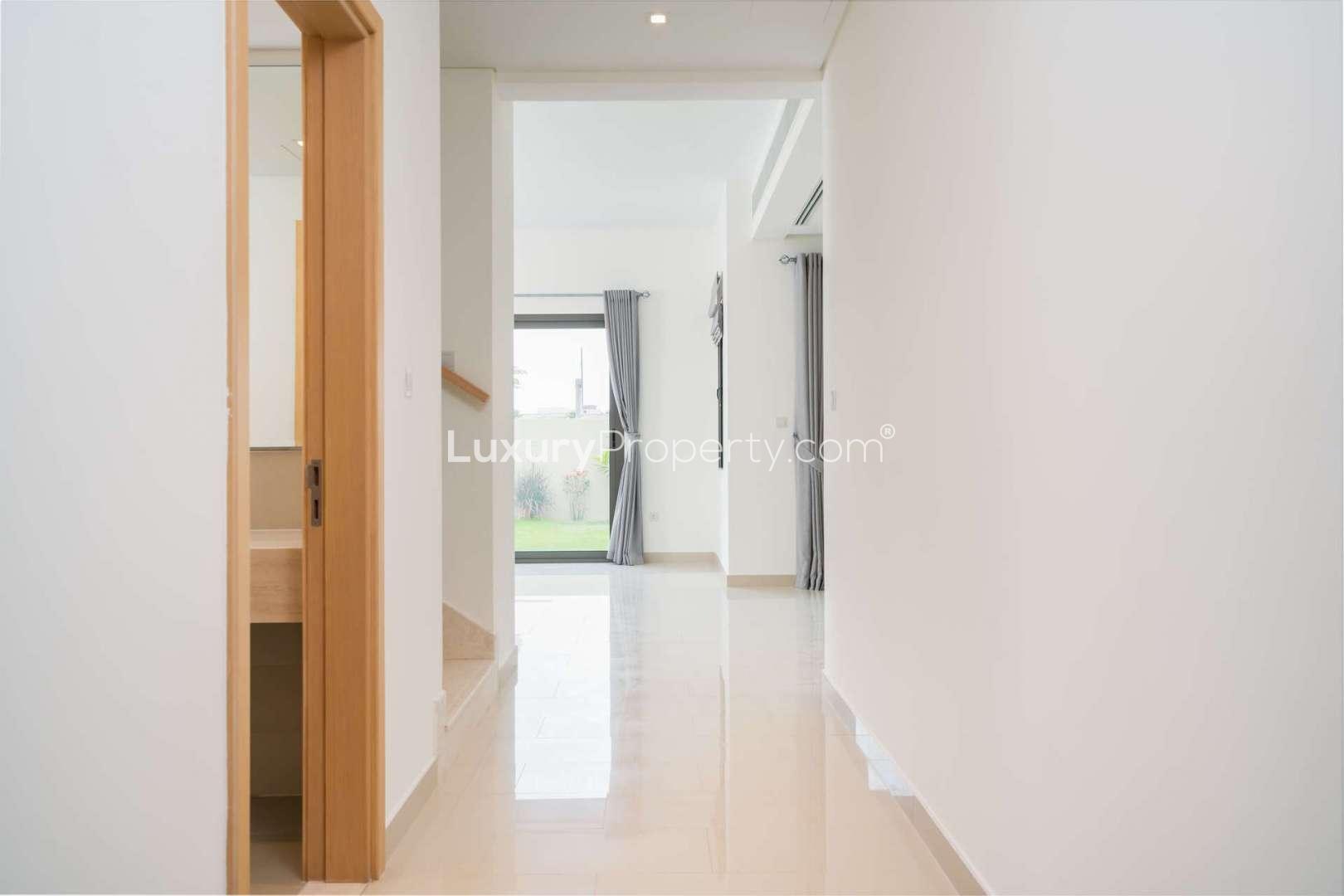 4-Bedroom Villa Exterior in Azalea, Arabian Ranches 2, Family-Friendly Rental Property,Hallway in 4-bedroom villa, Azalea, Arabian Ranches 2, featuring bright interiors and garden view