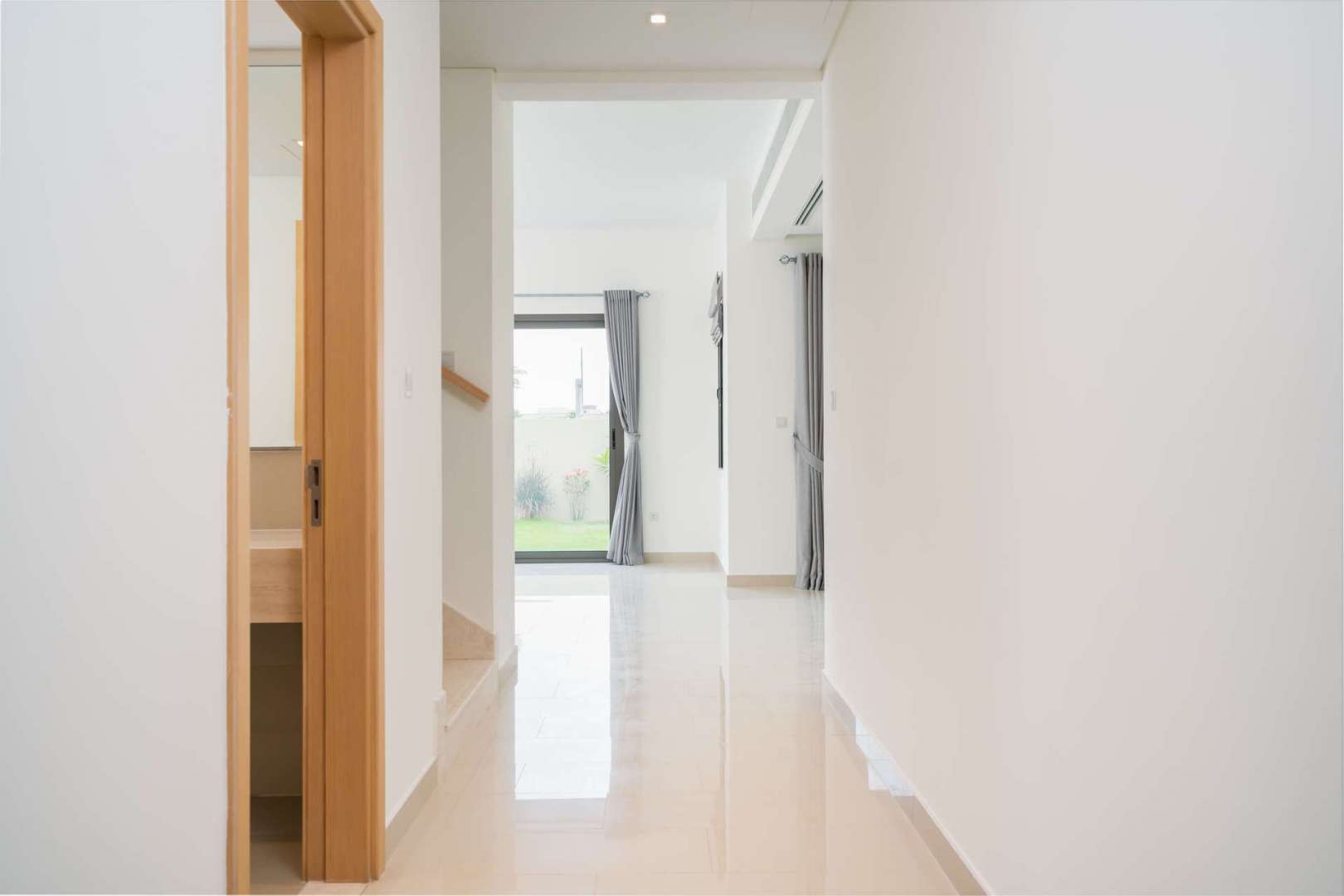 4-Bedroom Villa Exterior in Azalea, Arabian Ranches 2, Family-Friendly Rental Property,Hallway in 4-bedroom villa, Azalea, Arabian Ranches 2, featuring bright interiors and garden view