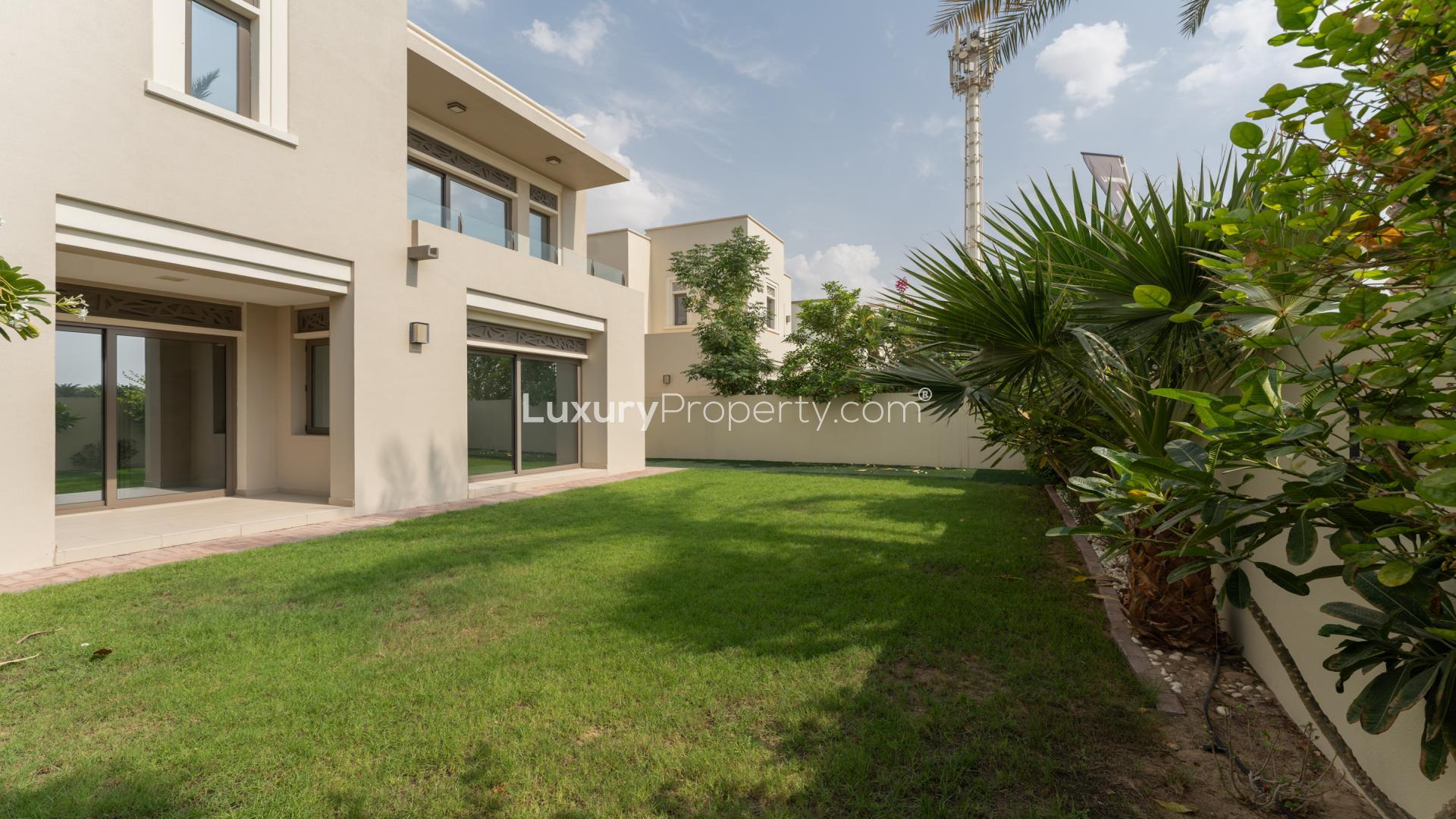 "Spacious backyard of modern 4-bedroom villa in Arabian Ranches 2, Azalea community.",Bright, spacious living area in modern 4-bedroom villa, Arabian Ranches 2, Azalea community