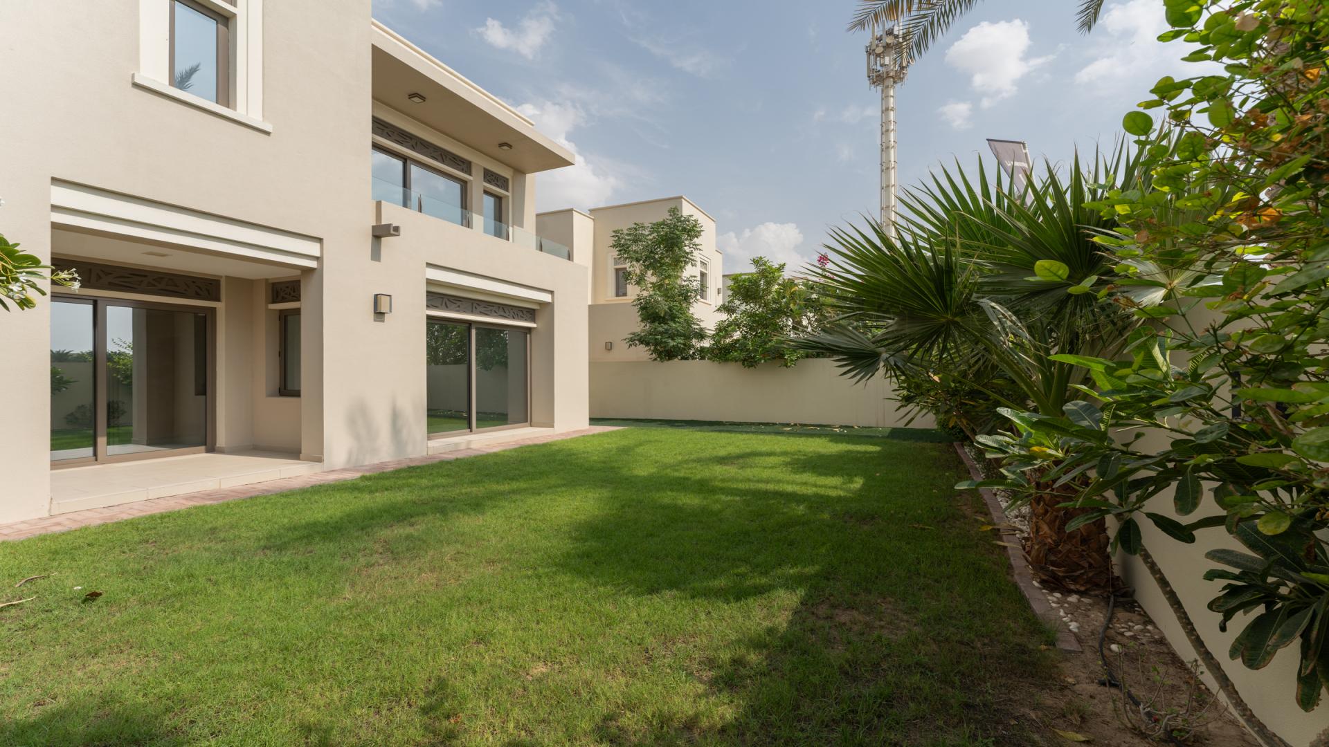 "Spacious backyard of modern 4-bedroom villa in Arabian Ranches 2, Azalea community.",Bright, spacious living area in modern 4-bedroom villa, Arabian Ranches 2, Azalea community