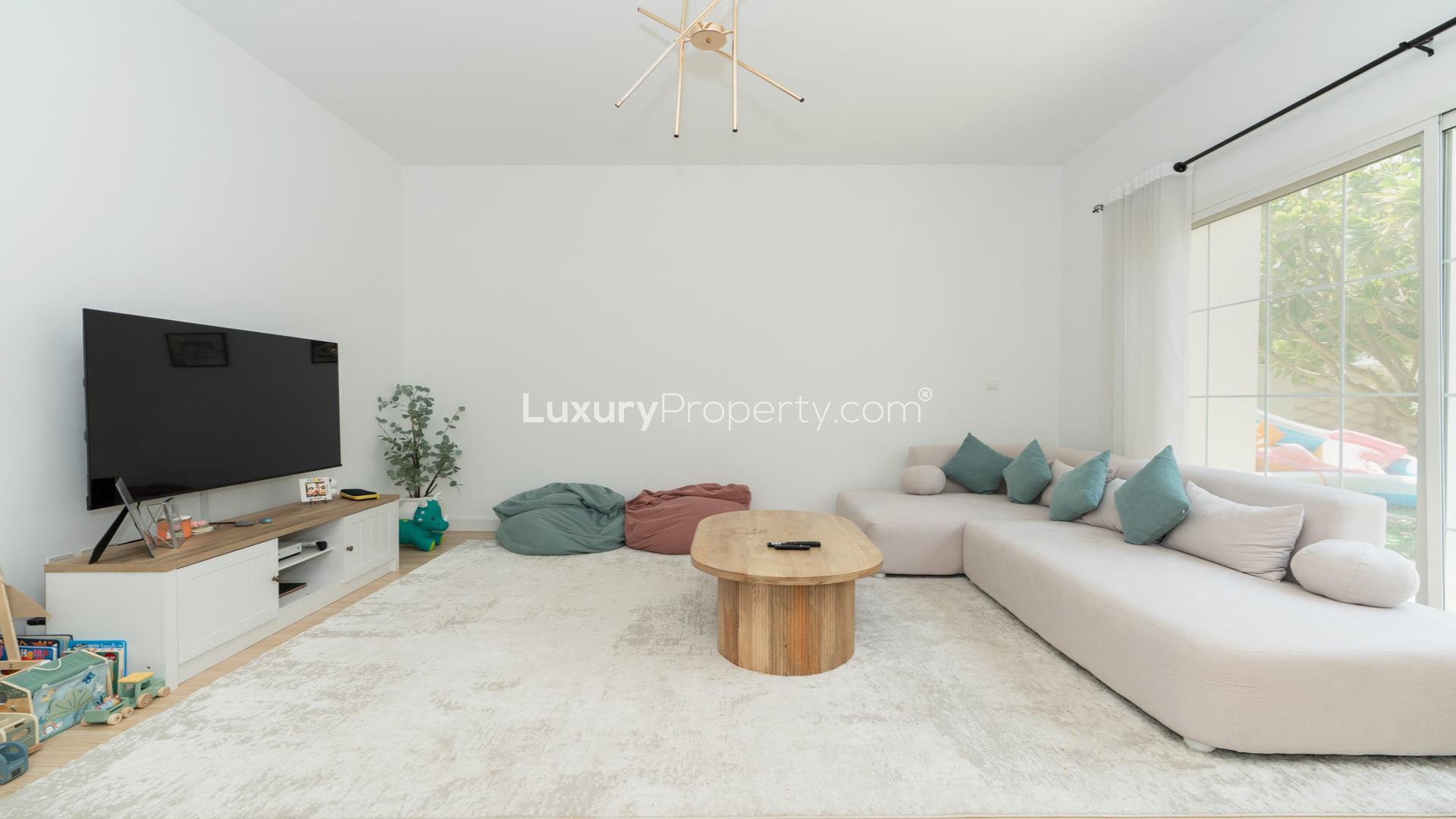 "Beautifully landscaped garden with seating area, Azalea Villa in Arabian Ranches 2 for rent.",Spacious living room in upgraded 4-bedroom villa, Arabian Ranches 2, Azalea, for rent