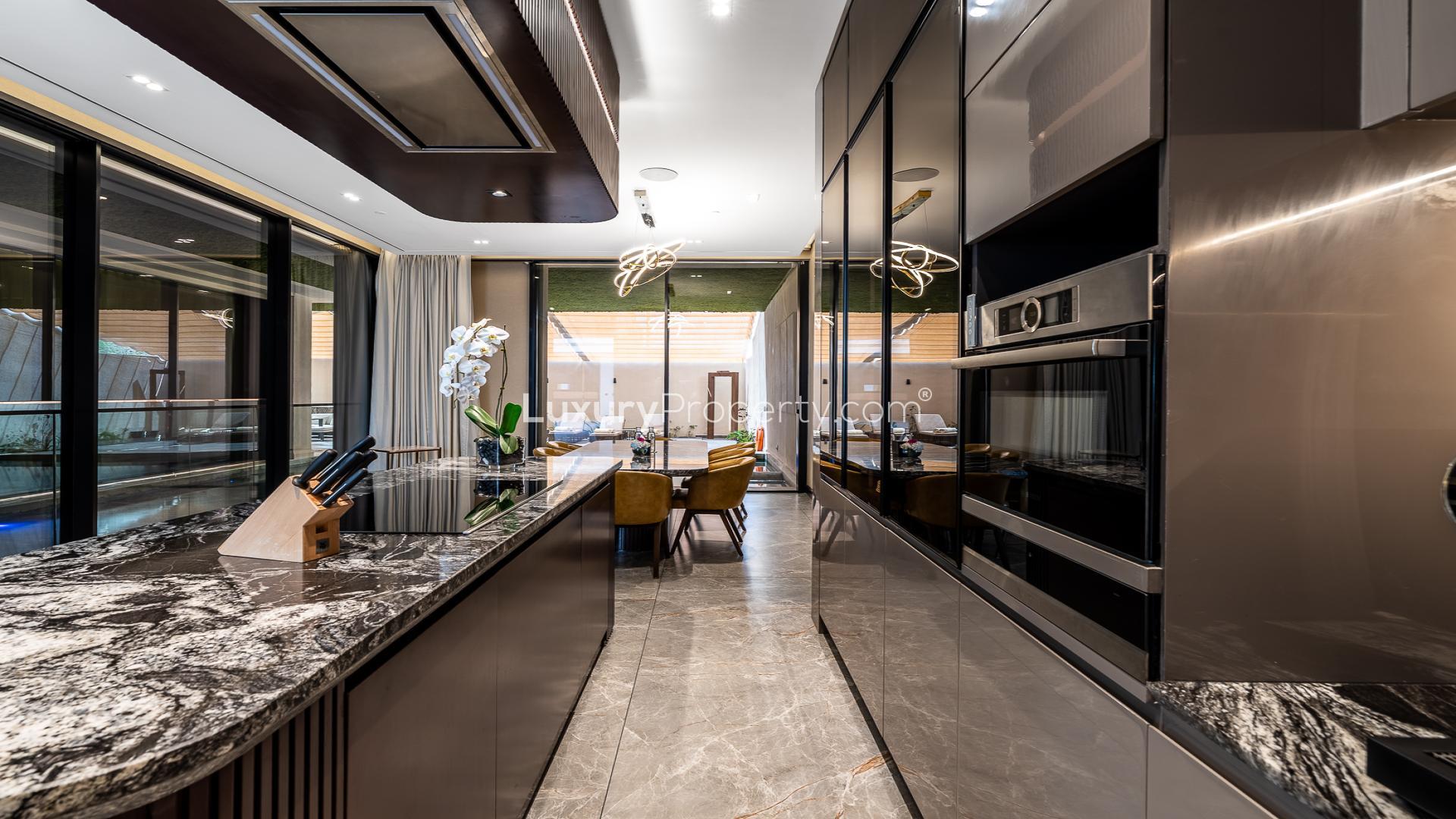 Luxury kitchen interior in Al Barsha villa for rent, featuring modern design and amenities