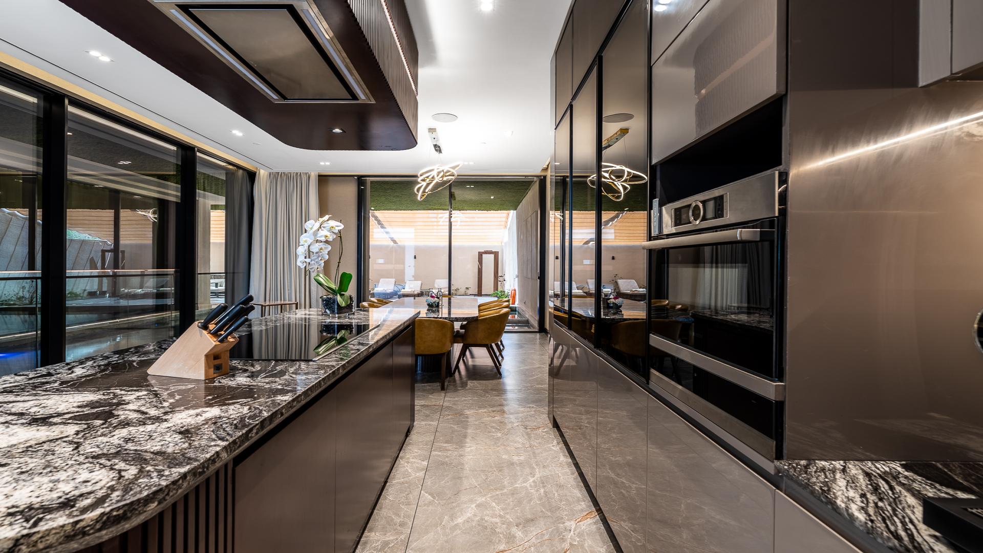 Luxury kitchen interior in Al Barsha villa for rent, featuring modern design and amenities