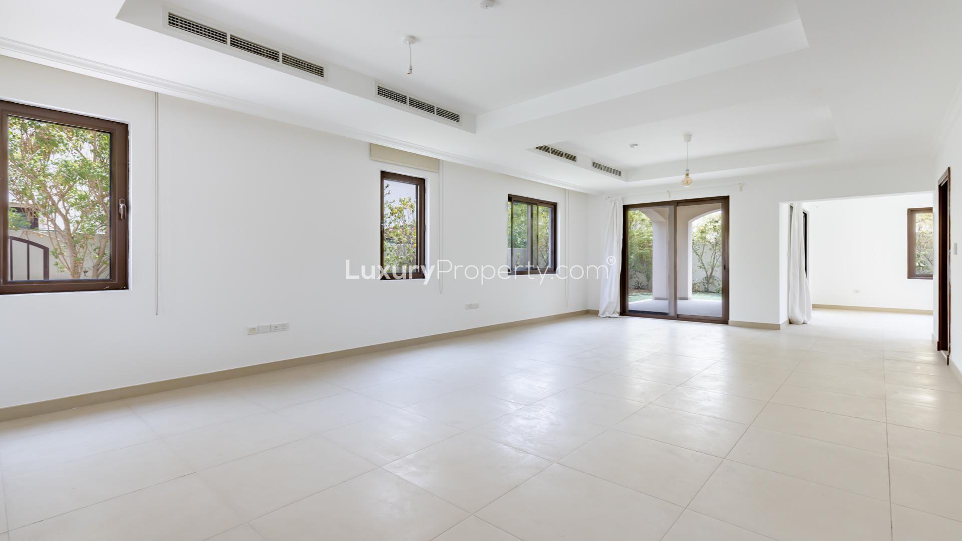 "Spacious 4-bedroom villa exterior in Lila, Arabian Ranches 2, with lush greenery.",Spacious living area in 4-bedroom villa for rent, Lila, Arabian Ranches 2