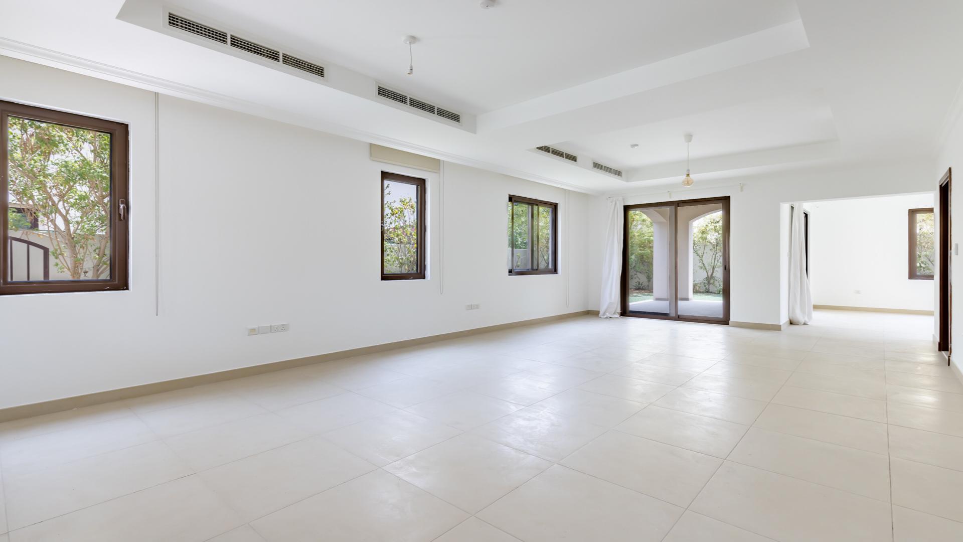 "Spacious 4-bedroom villa exterior in Lila, Arabian Ranches 2, with lush greenery.",Spacious living area in 4-bedroom villa for rent, Lila, Arabian Ranches 2
