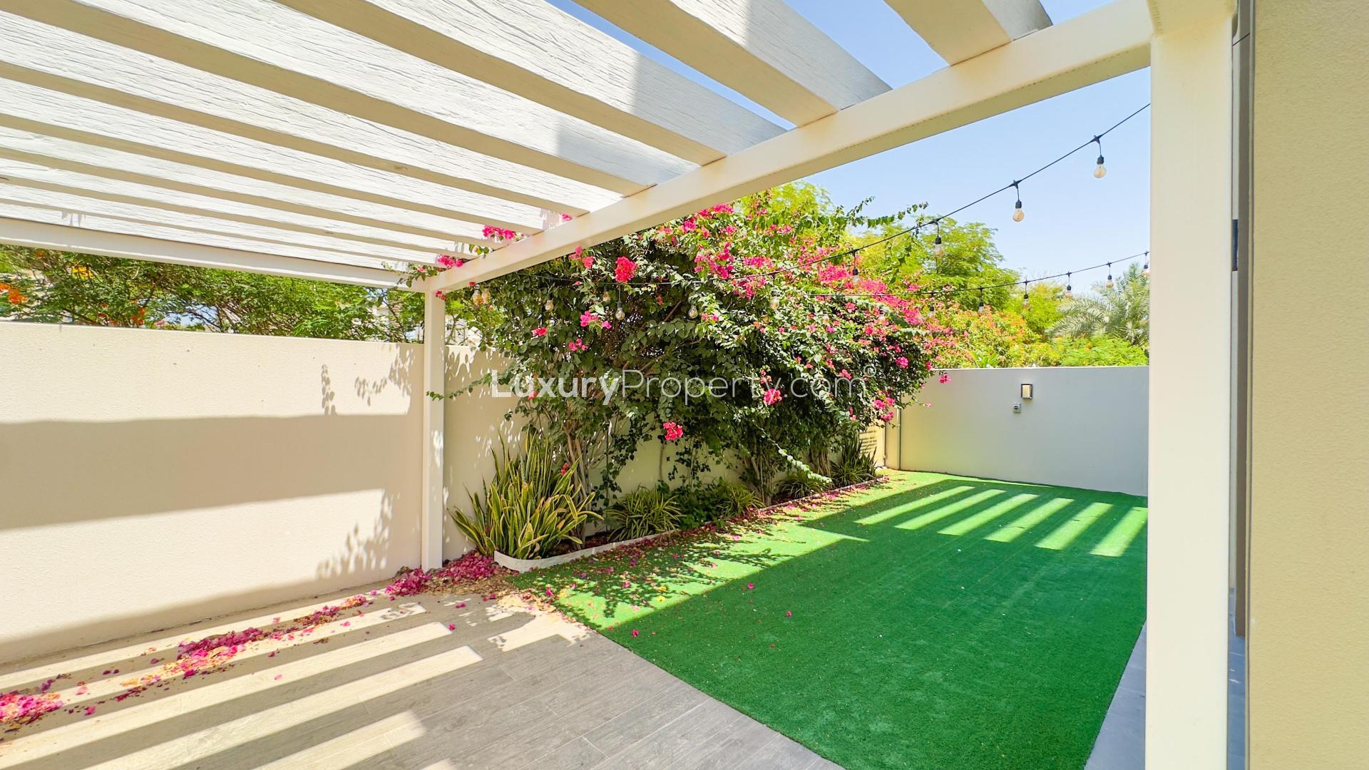 Bright dining area with modern chandelier in Reem Community villa, Arabian Ranches 2