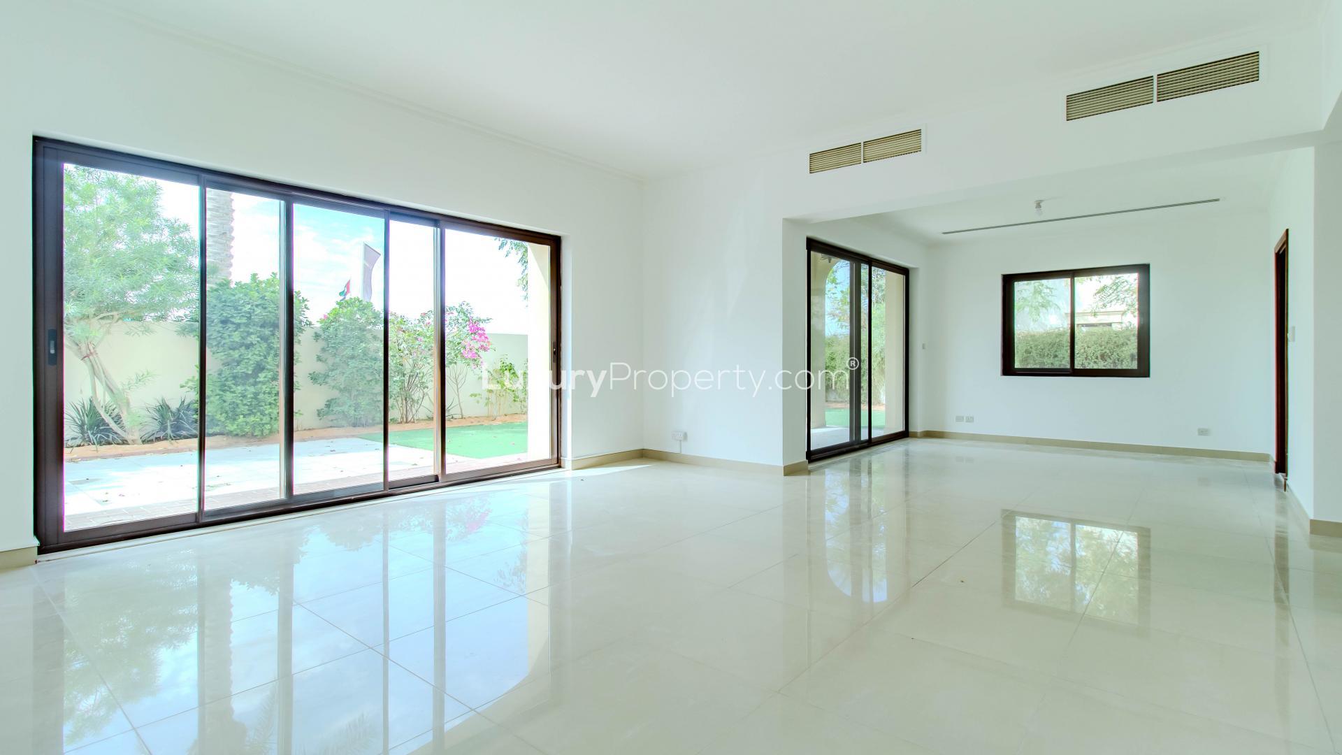 "Front view of 4-bedroom villa with garage in Samara, Arabian Ranches 2 for rent.",Spacious living area with garden view in Samara, Arabian Ranches 2 villa for rent