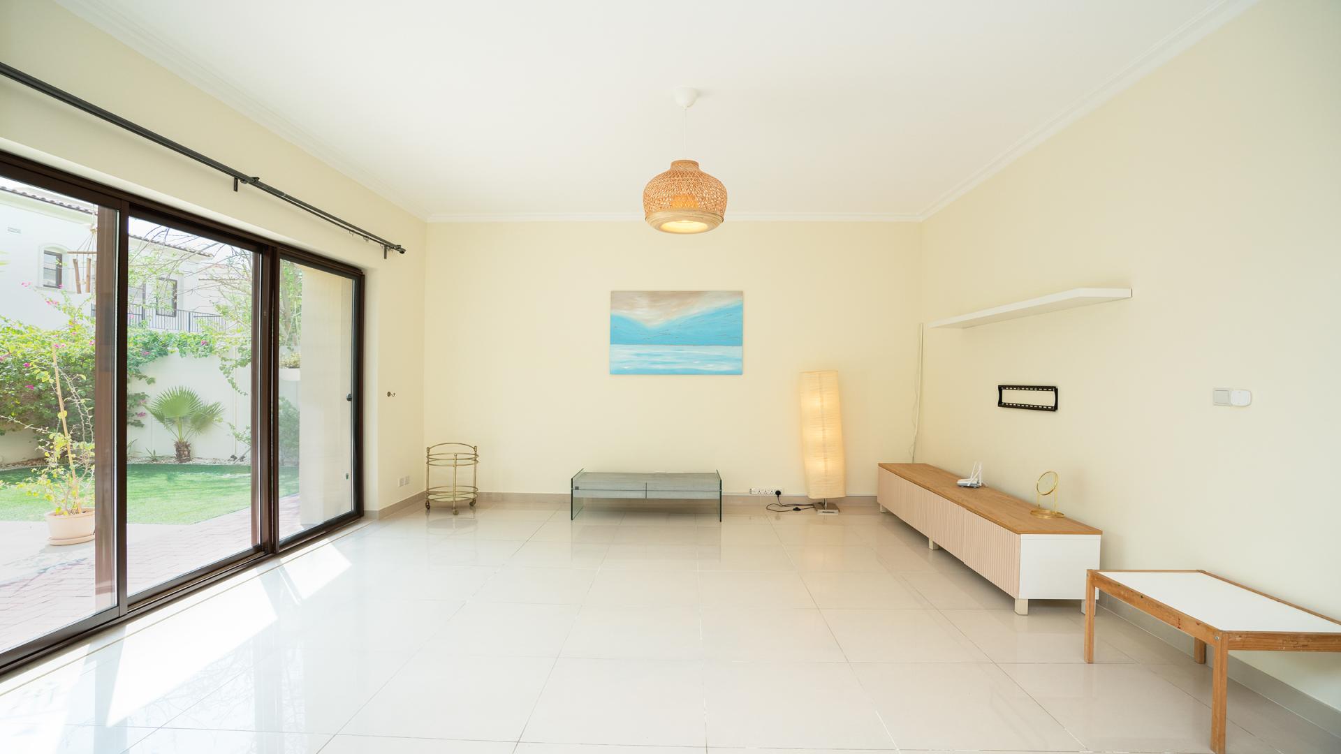 Bright living room with large windows in Samara villa, Arabian Ranches 2