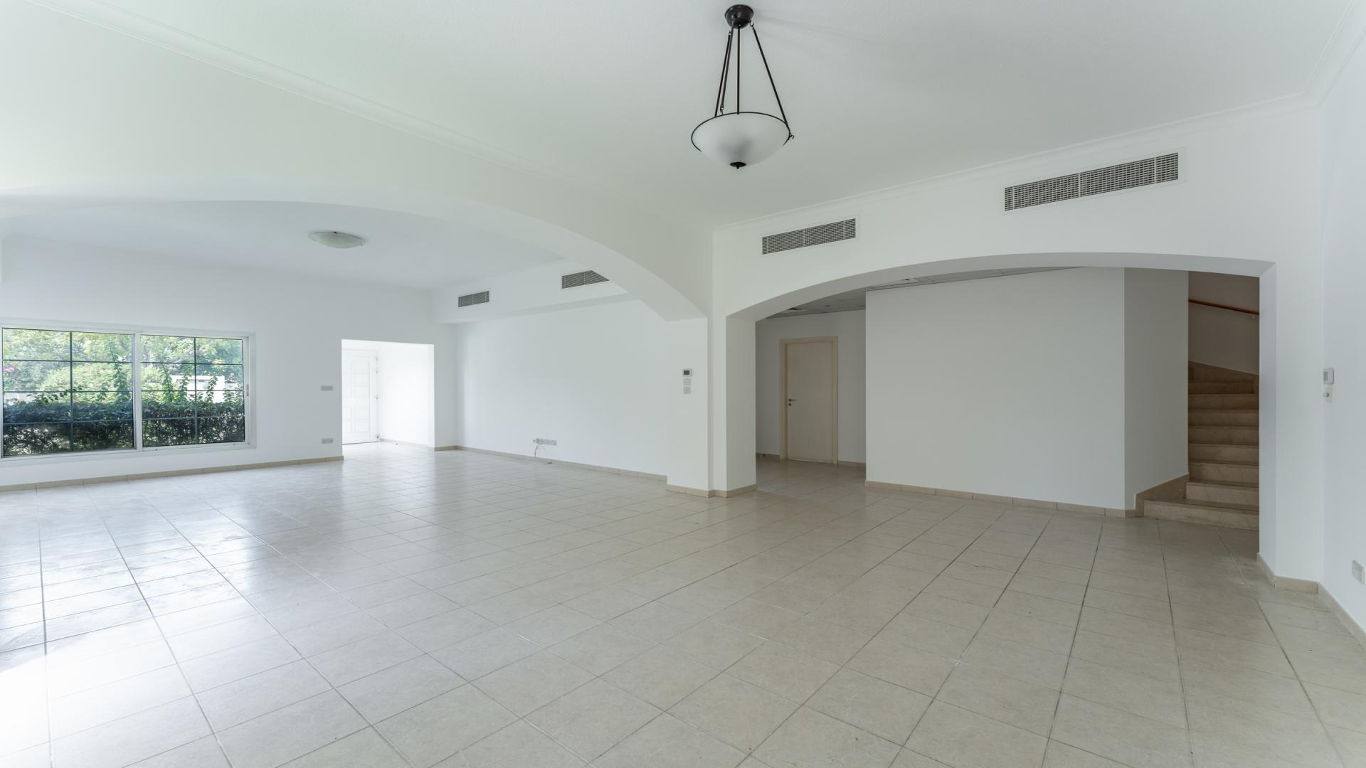 Spacious living area in elegant Deema villa, The Lakes, with tiled flooring and natural light