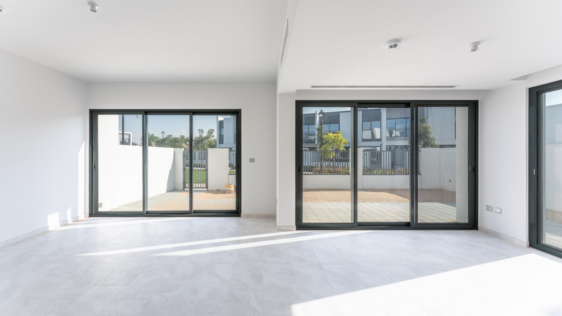 Spacious living area with large windows in Villanova villa for rent, Dubai Land