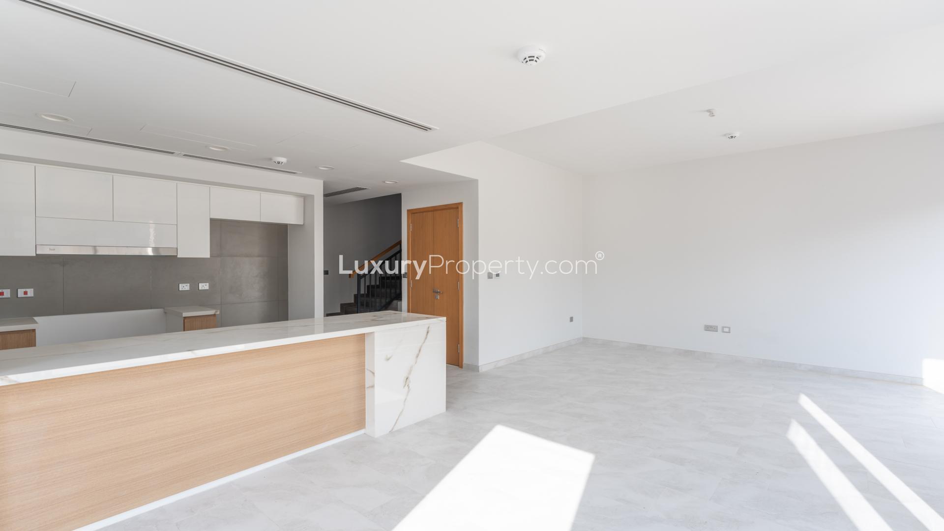 Bright living room with large windows in Villanova villa, Dubai Land for rent