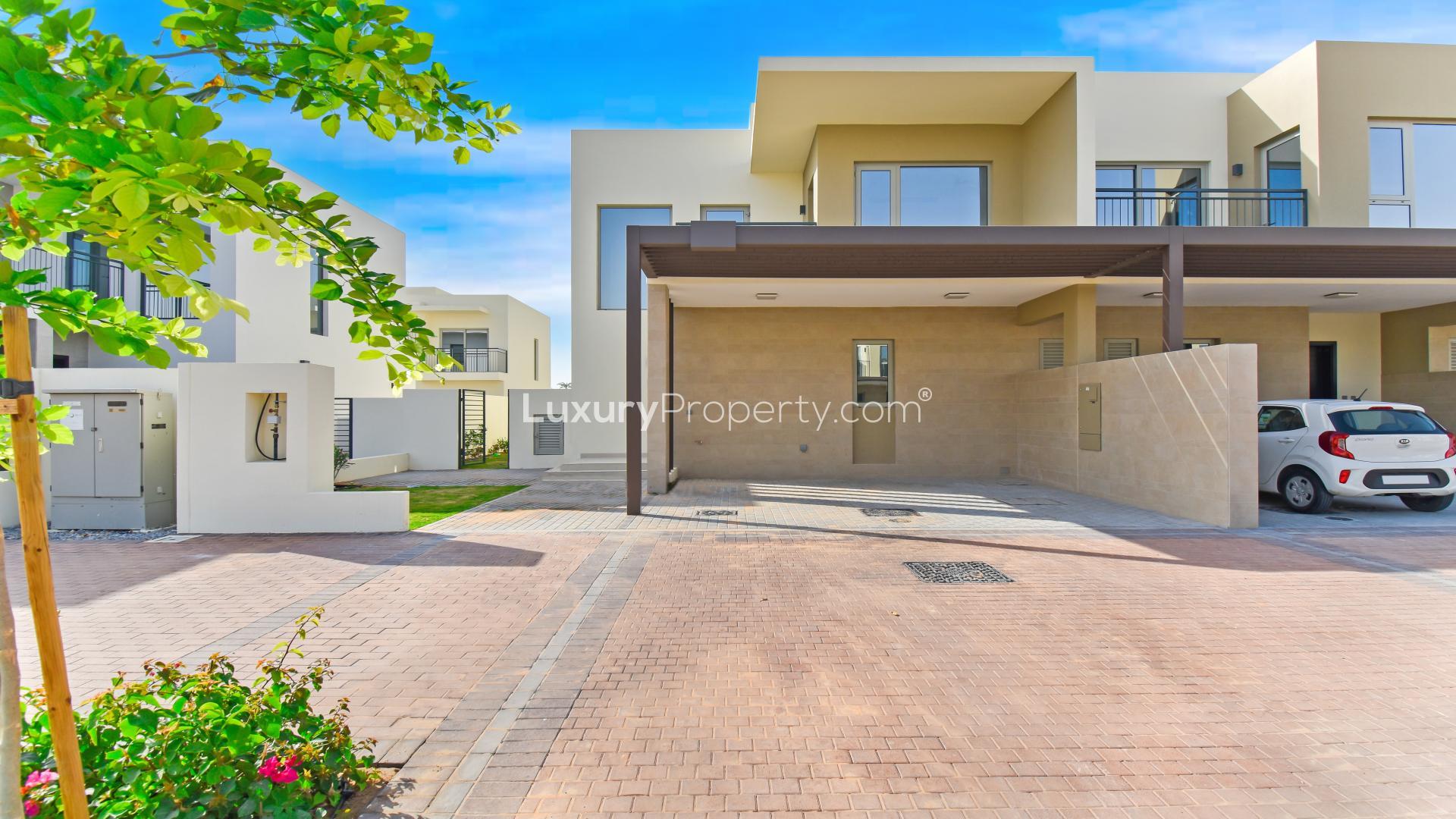 Modern Camelia Villa exterior with driveway in Arabian Ranches 2, available for rent