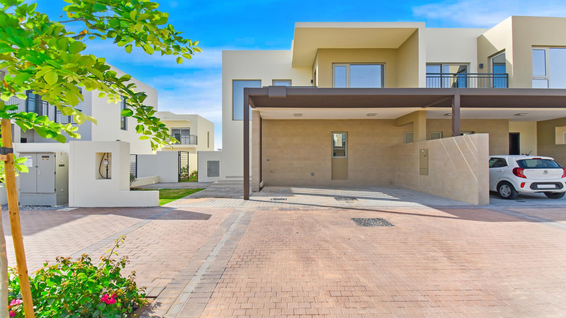 Modern Camelia Villa exterior with driveway in Arabian Ranches 2, available for rent