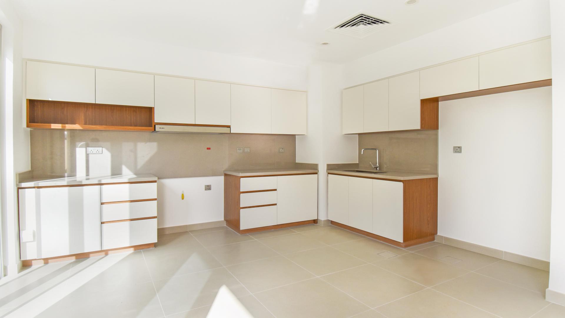 Modern kitchen and living area in brand new 4-bedroom villa, Arabian Ranches 2, Camelia