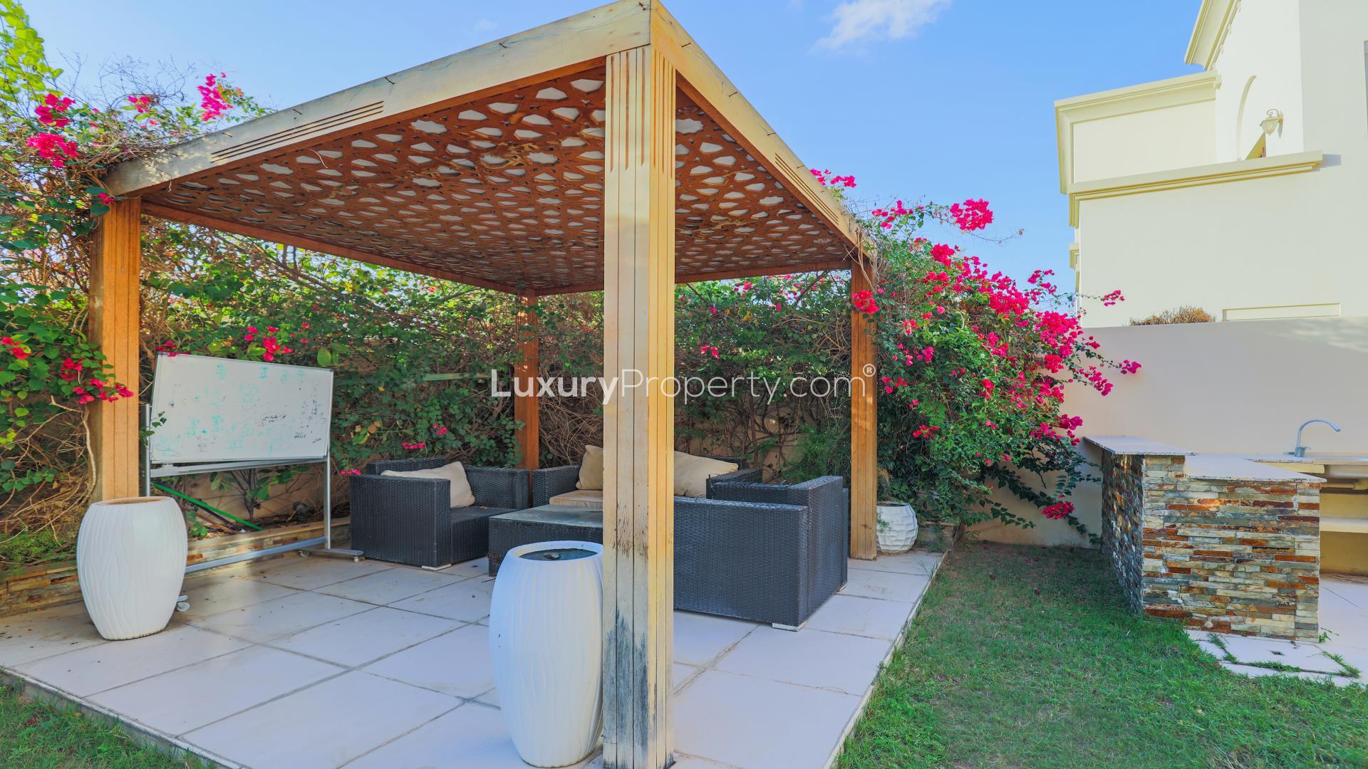 Upgraded villa with landscaped garden and seating area in Arabian Ranches 2, Casa community