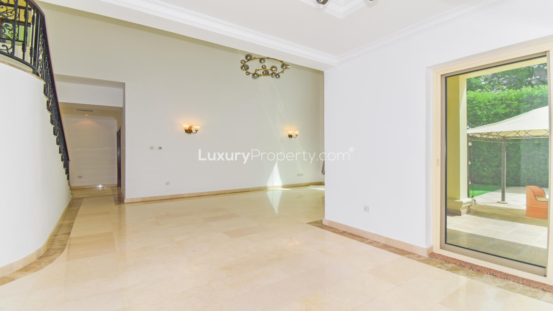 Elegant hallway in 4-bedroom villa, Jumeirah Islands, with marble flooring and natural light