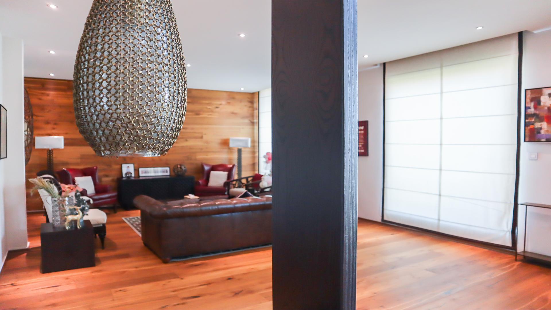 Furnished living area in four-bed villa, Jumeirah Island, wood accents, modern decor