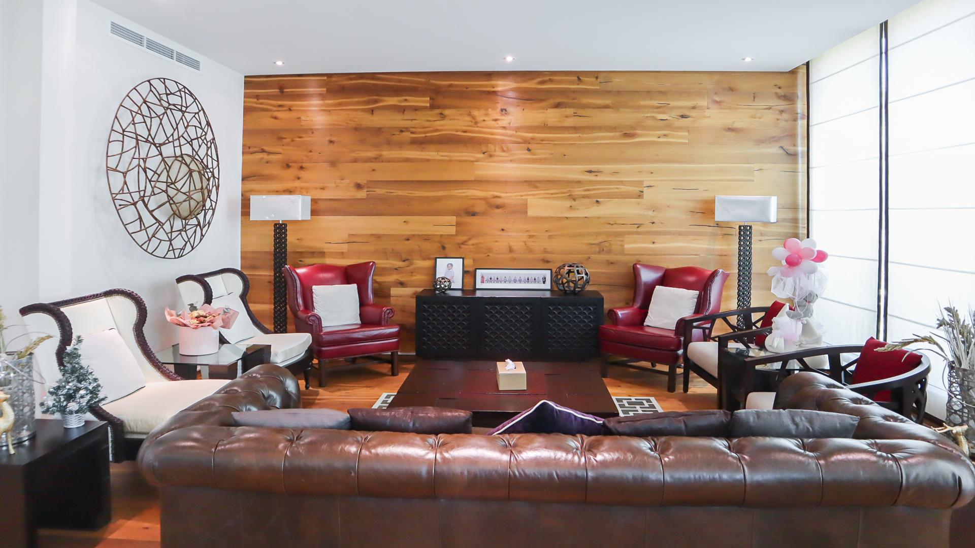 "Spacious garden of furnished four-bed villa in Jumeirah Islands, Cluster 36, for rent.",Furnished living room in four-bed villa, Jumeirah Islands, featuring elegant seating and decor