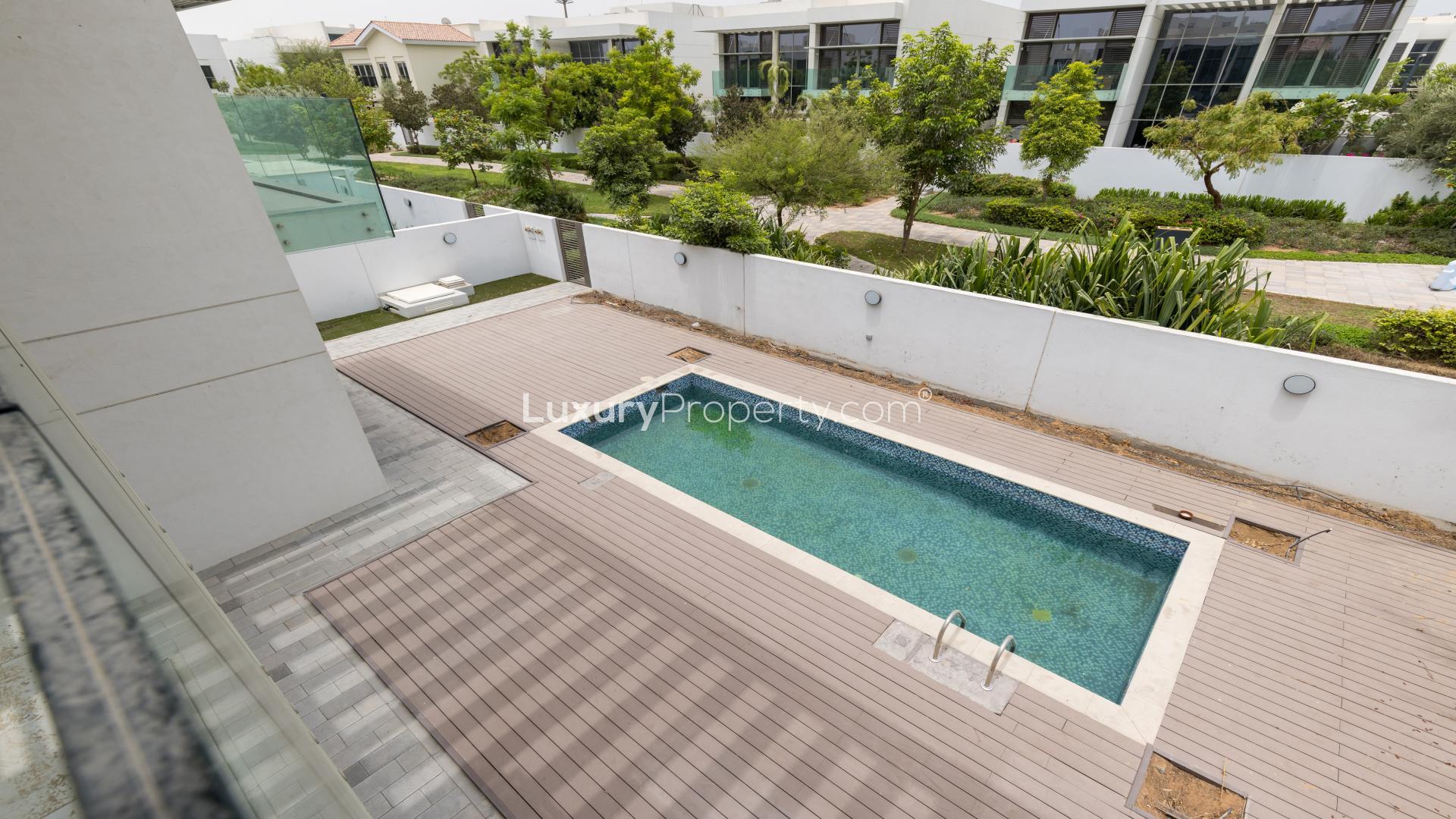 Spacious living room with pool view in District One villa, Mohammed Bin Rashid City