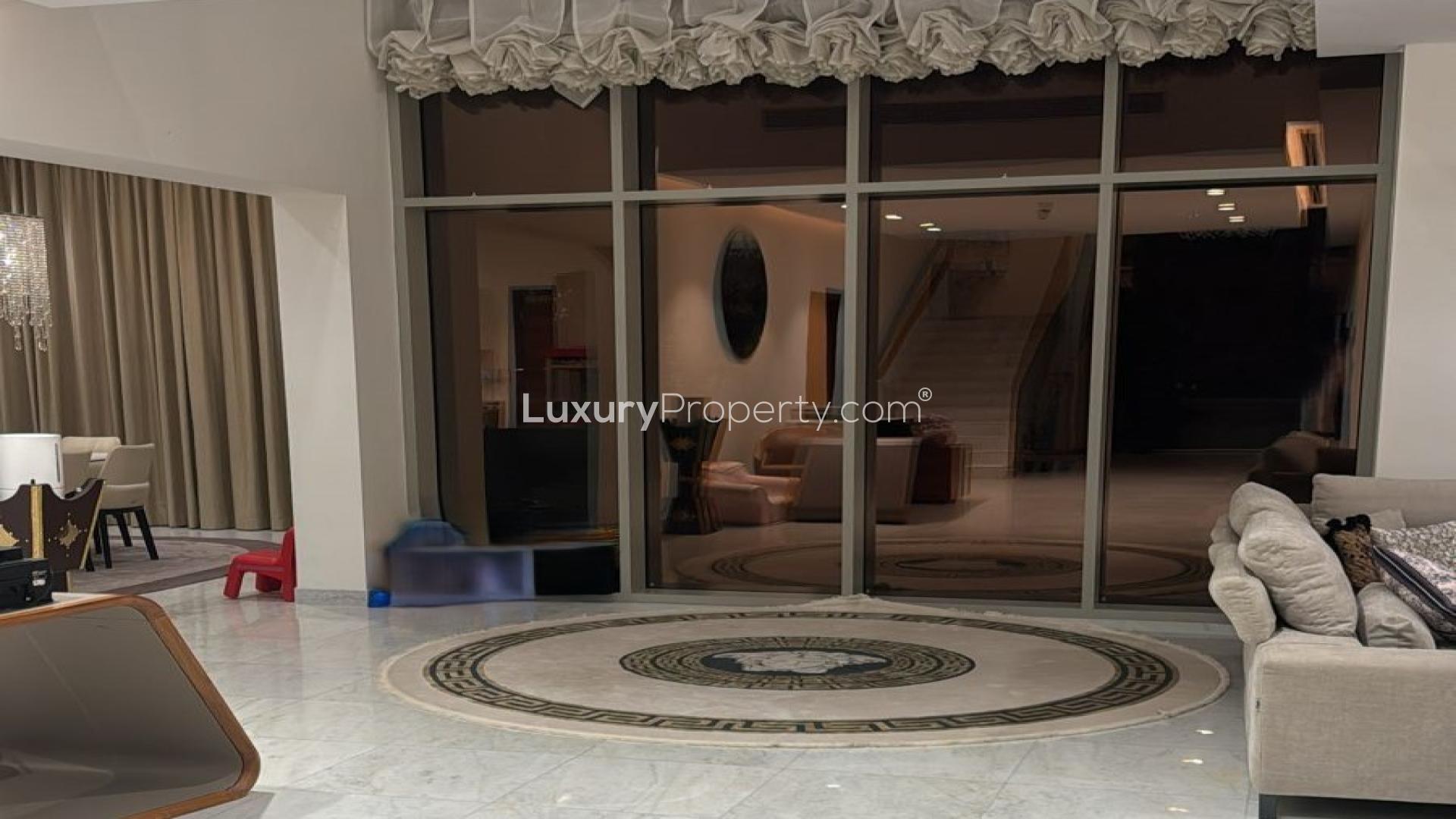 Elegant dining room with chandelier in District One 4-bedroom villa, MBR City